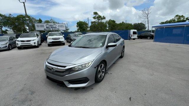 2018 Silver Honda Civic Sedan EX (19XFC2F72JE) with an 4 2.0 L engine, Variable transmission, located at 27610 S Dixie Hwy, Homestead, FL, 33032, (305) 749-2348, 25.510241, -80.438301 - KBB.com 10 Most Awarded Brands. Boasts 40 Highway MPG and 31 City MPG! This Honda Civic Sedan delivers a Regular Unleaded I-4 2.0 L/122 engine powering this Variable transmission. Wheels: 16 Alloy, Wheels w/Silver Accents, VSA Electronic Stability Control (ESC).* This Honda Civic Sedan Features the - Photo#0