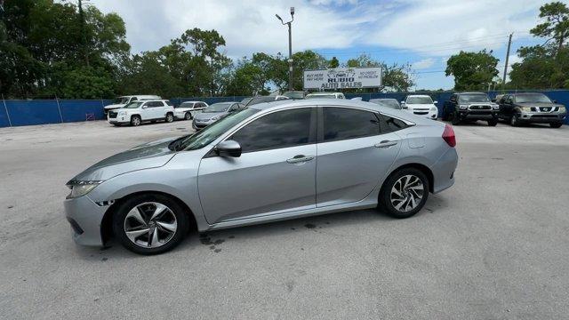 2018 Silver Honda Civic Sedan EX (19XFC2F72JE) with an 4 2.0 L engine, Variable transmission, located at 27610 S Dixie Hwy, Homestead, FL, 33032, (305) 749-2348, 25.510241, -80.438301 - KBB.com 10 Most Awarded Brands. Boasts 40 Highway MPG and 31 City MPG! This Honda Civic Sedan delivers a Regular Unleaded I-4 2.0 L/122 engine powering this Variable transmission. Wheels: 16 Alloy, Wheels w/Silver Accents, VSA Electronic Stability Control (ESC).* This Honda Civic Sedan Features the - Photo#1