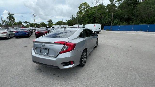 2018 Silver Honda Civic Sedan EX (19XFC2F72JE) with an 4 2.0 L engine, Variable transmission, located at 27610 S Dixie Hwy, Homestead, FL, 33032, (305) 749-2348, 25.510241, -80.438301 - KBB.com 10 Most Awarded Brands. Boasts 40 Highway MPG and 31 City MPG! This Honda Civic Sedan delivers a Regular Unleaded I-4 2.0 L/122 engine powering this Variable transmission. Wheels: 16 Alloy, Wheels w/Silver Accents, VSA Electronic Stability Control (ESC).* This Honda Civic Sedan Features the - Photo#4