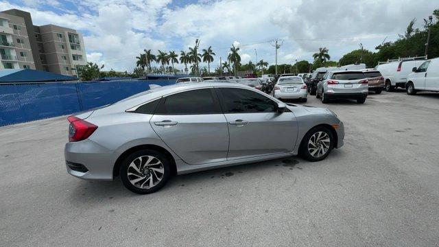 2018 Silver Honda Civic Sedan EX (19XFC2F72JE) with an 4 2.0 L engine, Variable transmission, located at 27610 S Dixie Hwy, Homestead, FL, 33032, (305) 749-2348, 25.510241, -80.438301 - KBB.com 10 Most Awarded Brands. Boasts 40 Highway MPG and 31 City MPG! This Honda Civic Sedan delivers a Regular Unleaded I-4 2.0 L/122 engine powering this Variable transmission. Wheels: 16 Alloy, Wheels w/Silver Accents, VSA Electronic Stability Control (ESC).* This Honda Civic Sedan Features the - Photo#5