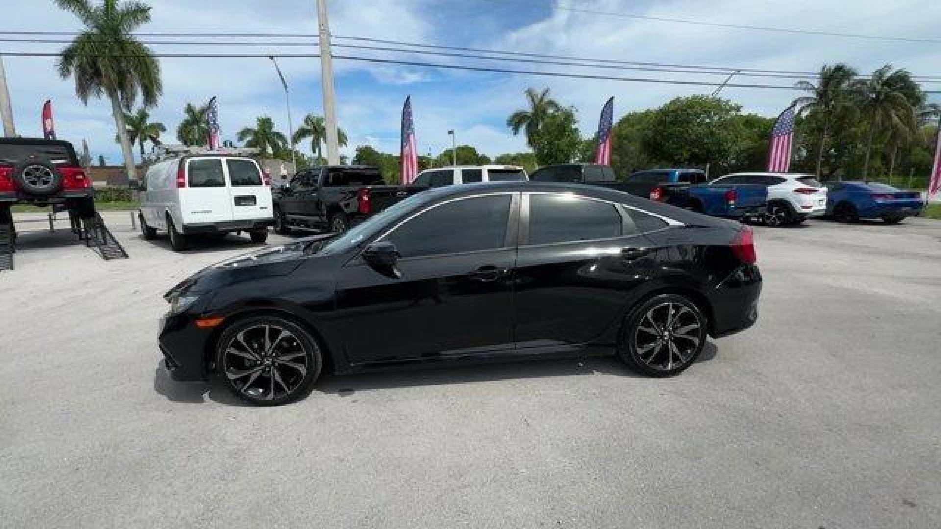 2021 Black Honda Civic Sedan Sport (2HGFC2F8XMH) with an 4 2.0 L engine, Variable transmission, located at 27610 S Dixie Hwy, Homestead, FL, 33032, (305) 749-2348, 25.510241, -80.438301 - Only 40,080 Miles! Scores 37 Highway MPG and 29 City MPG! This Honda Civic Sedan delivers a Regular Unleaded I-4 2.0 L/122 engine powering this Variable transmission. Window Grid Antenna, Wheels: 18 Alloy w/Gloss Black Inserts, Vehicle Stability Assist (VSA) Electronic Stability Control (ESC).* This - Photo#1