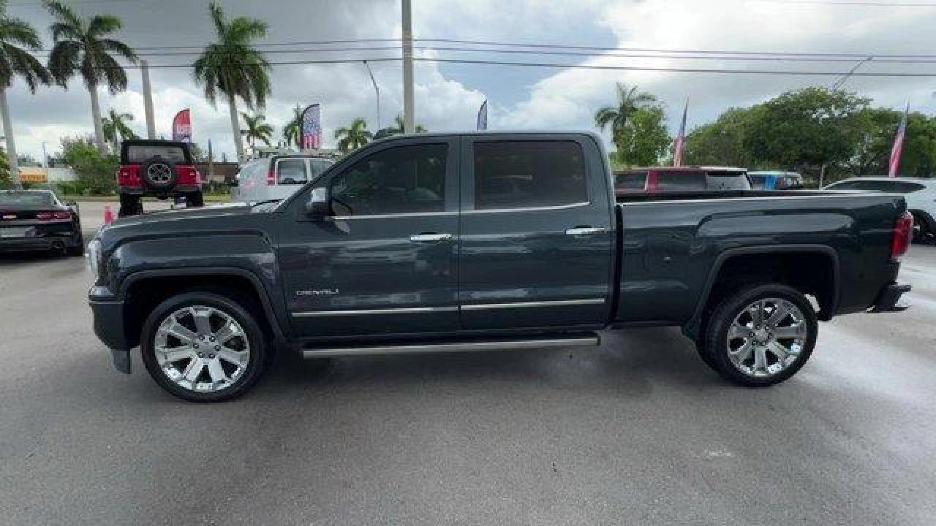 2018 Dark Slate Metallic /Jet Black GMC Sierra 1500 Denali (3GTU2PEJ0JG) with an 8 6.2L engine, Automatic transmission, located at 27610 S Dixie Hwy, Homestead, FL, 33032, (305) 749-2348, 25.510241, -80.438301 - Delivers 20 Highway MPG and 15 City MPG! This GMC Sierra 1500 boasts a Gas V8 6.2L/376 engine powering this Automatic transmission. WHEELS, 22 (55.9 CM) ALUMINUM with premium paint and chrome inserts, TRI-MODE POWER STEPS, REARWARD ARTICULATING (providing bed access). Foot activated running side boa - Photo#1