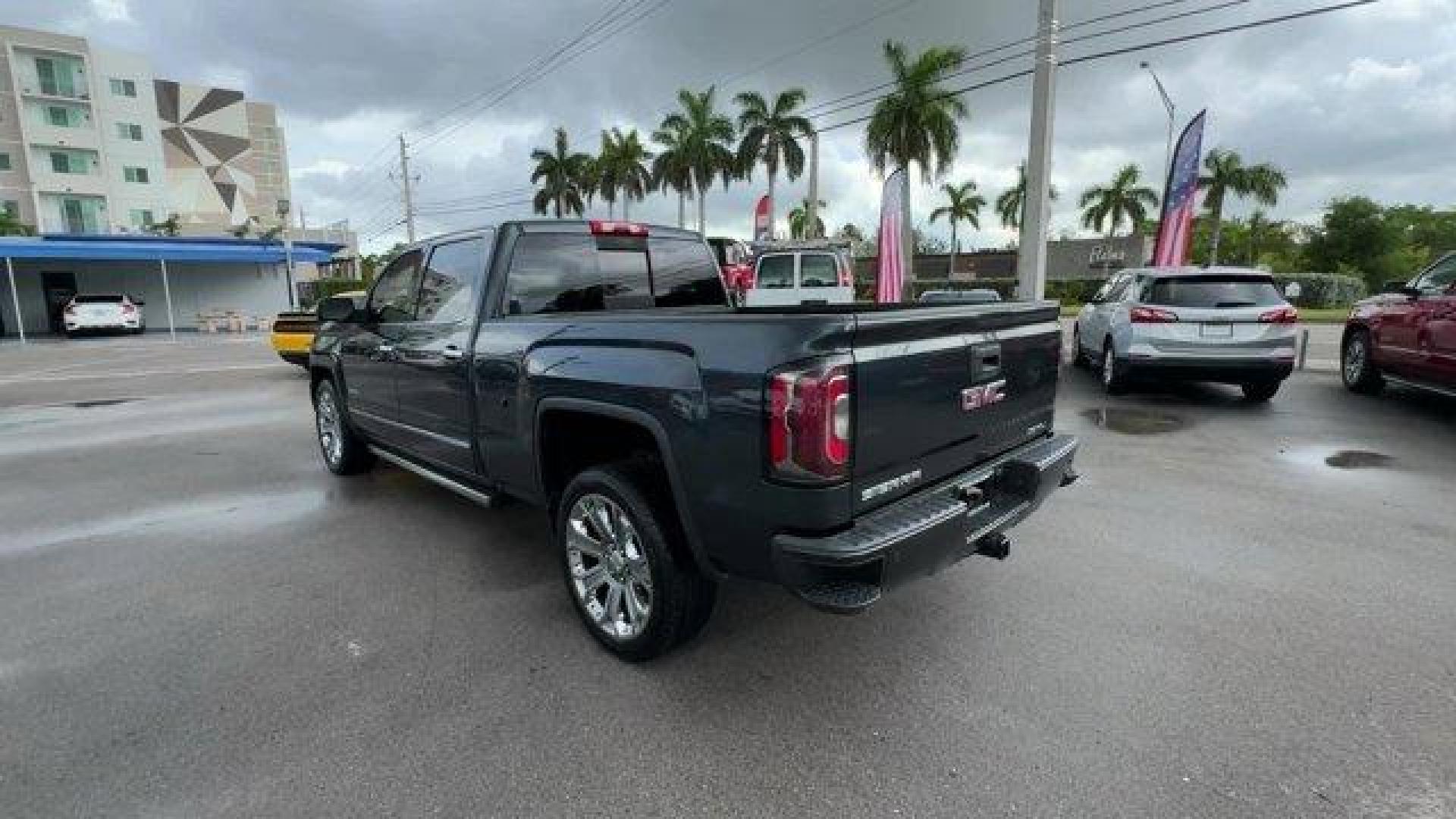 2018 Dark Slate Metallic /Jet Black GMC Sierra 1500 Denali (3GTU2PEJ0JG) with an 8 6.2L engine, Automatic transmission, located at 27610 S Dixie Hwy, Homestead, FL, 33032, (305) 749-2348, 25.510241, -80.438301 - Delivers 20 Highway MPG and 15 City MPG! This GMC Sierra 1500 boasts a Gas V8 6.2L/376 engine powering this Automatic transmission. WHEELS, 22 (55.9 CM) ALUMINUM with premium paint and chrome inserts, TRI-MODE POWER STEPS, REARWARD ARTICULATING (providing bed access). Foot activated running side boa - Photo#2