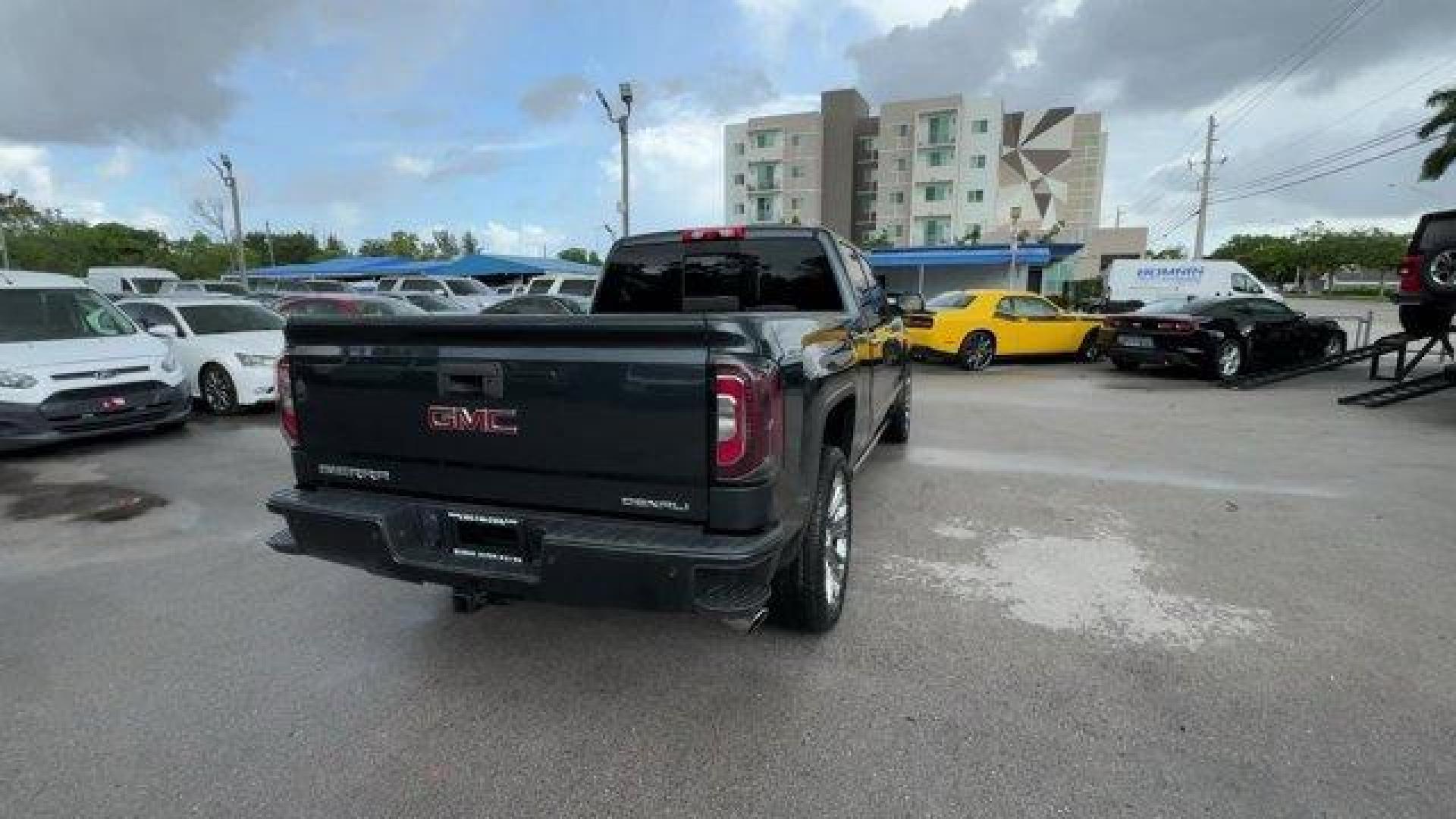 2018 Dark Slate Metallic /Jet Black GMC Sierra 1500 Denali (3GTU2PEJ0JG) with an 8 6.2L engine, Automatic transmission, located at 27610 S Dixie Hwy, Homestead, FL, 33032, (305) 749-2348, 25.510241, -80.438301 - Delivers 20 Highway MPG and 15 City MPG! This GMC Sierra 1500 boasts a Gas V8 6.2L/376 engine powering this Automatic transmission. WHEELS, 22 (55.9 CM) ALUMINUM with premium paint and chrome inserts, TRI-MODE POWER STEPS, REARWARD ARTICULATING (providing bed access). Foot activated running side boa - Photo#4