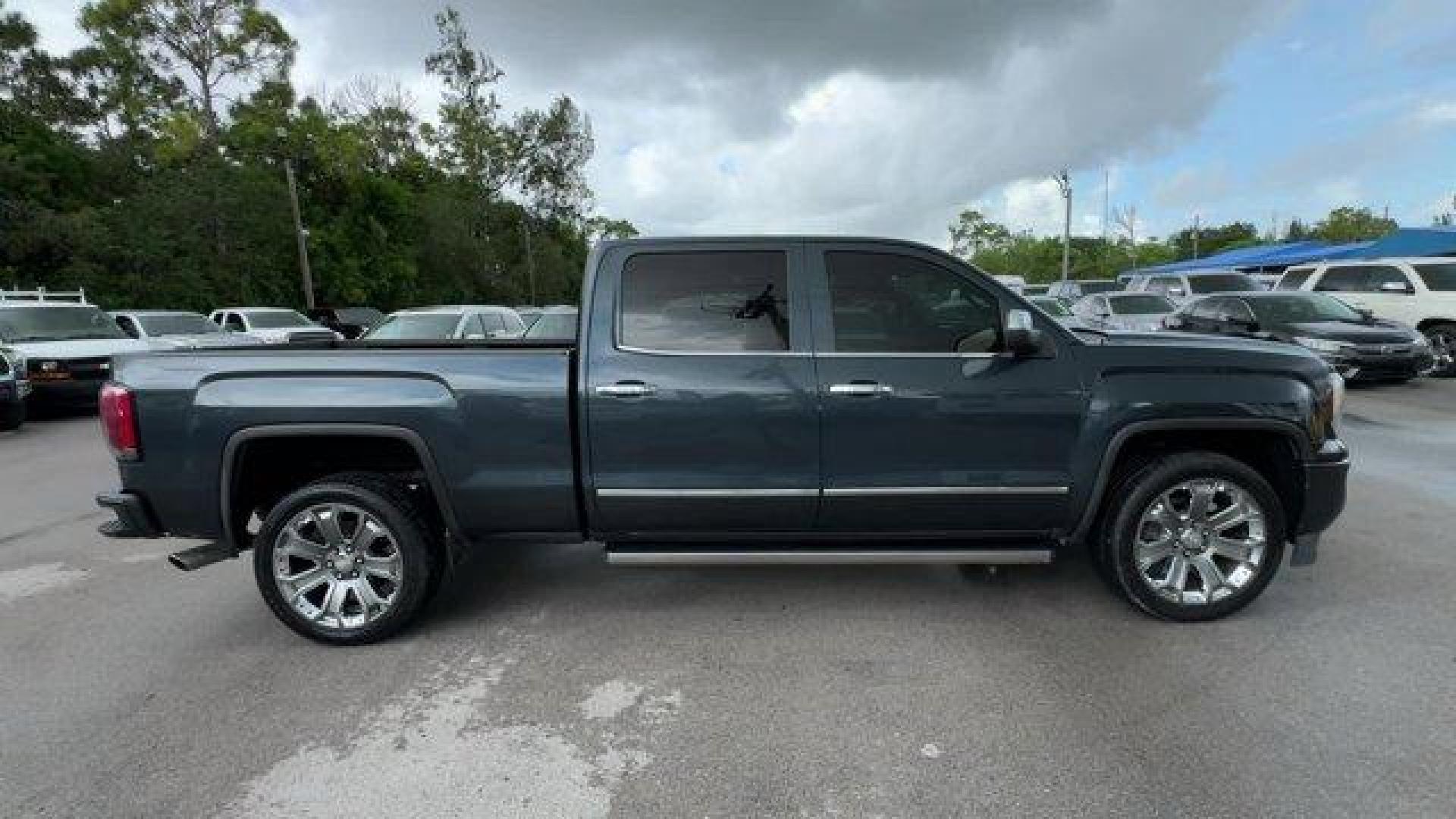 2018 Dark Slate Metallic /Jet Black GMC Sierra 1500 Denali (3GTU2PEJ0JG) with an 8 6.2L engine, Automatic transmission, located at 27610 S Dixie Hwy, Homestead, FL, 33032, (305) 749-2348, 25.510241, -80.438301 - Delivers 20 Highway MPG and 15 City MPG! This GMC Sierra 1500 boasts a Gas V8 6.2L/376 engine powering this Automatic transmission. WHEELS, 22 (55.9 CM) ALUMINUM with premium paint and chrome inserts, TRI-MODE POWER STEPS, REARWARD ARTICULATING (providing bed access). Foot activated running side boa - Photo#5