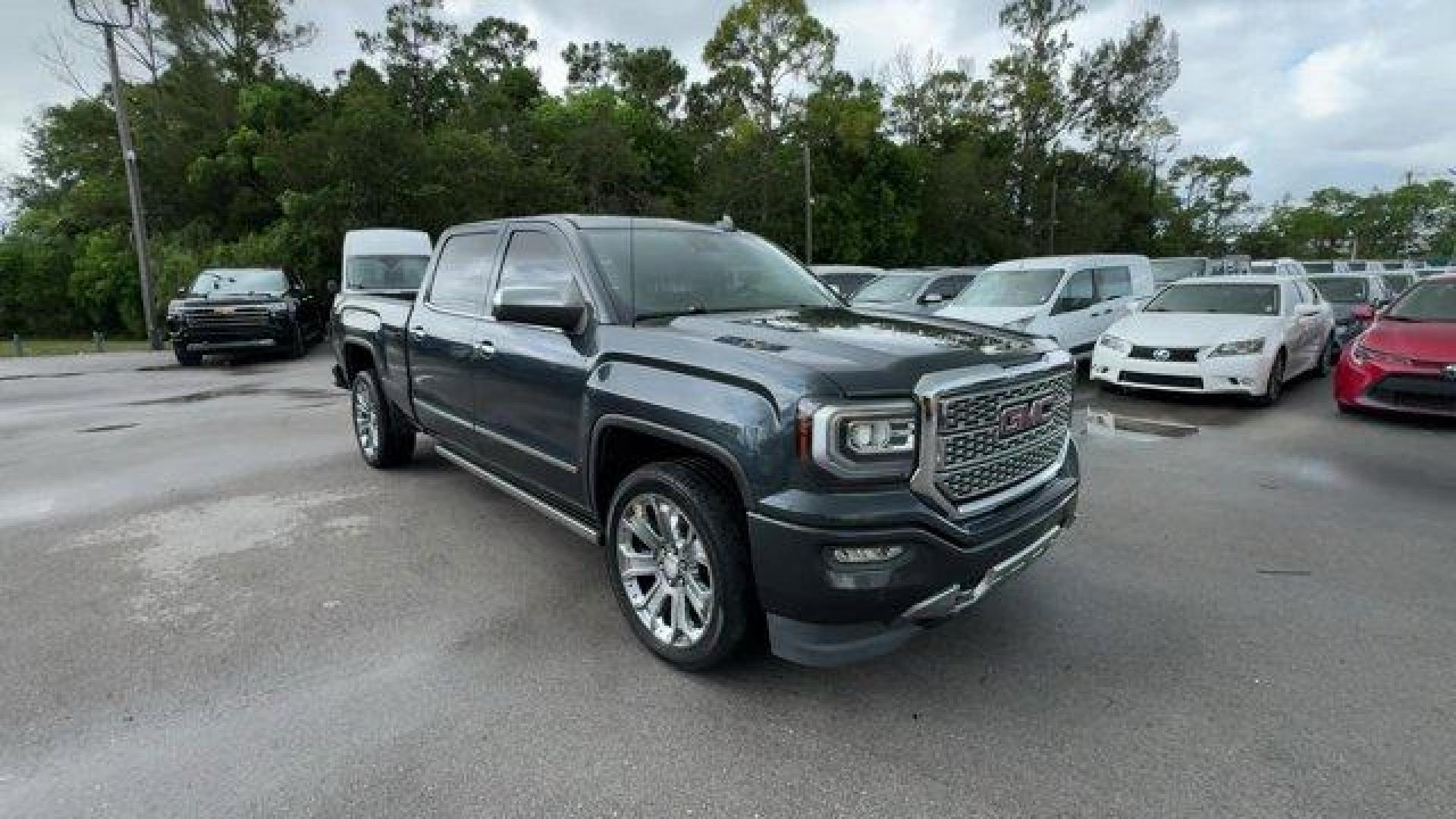 2018 Dark Slate Metallic /Jet Black GMC Sierra 1500 Denali (3GTU2PEJ0JG) with an 8 6.2L engine, Automatic transmission, located at 27610 S Dixie Hwy, Homestead, FL, 33032, (305) 749-2348, 25.510241, -80.438301 - Delivers 20 Highway MPG and 15 City MPG! This GMC Sierra 1500 boasts a Gas V8 6.2L/376 engine powering this Automatic transmission. WHEELS, 22 (55.9 CM) ALUMINUM with premium paint and chrome inserts, TRI-MODE POWER STEPS, REARWARD ARTICULATING (providing bed access). Foot activated running side boa - Photo#6