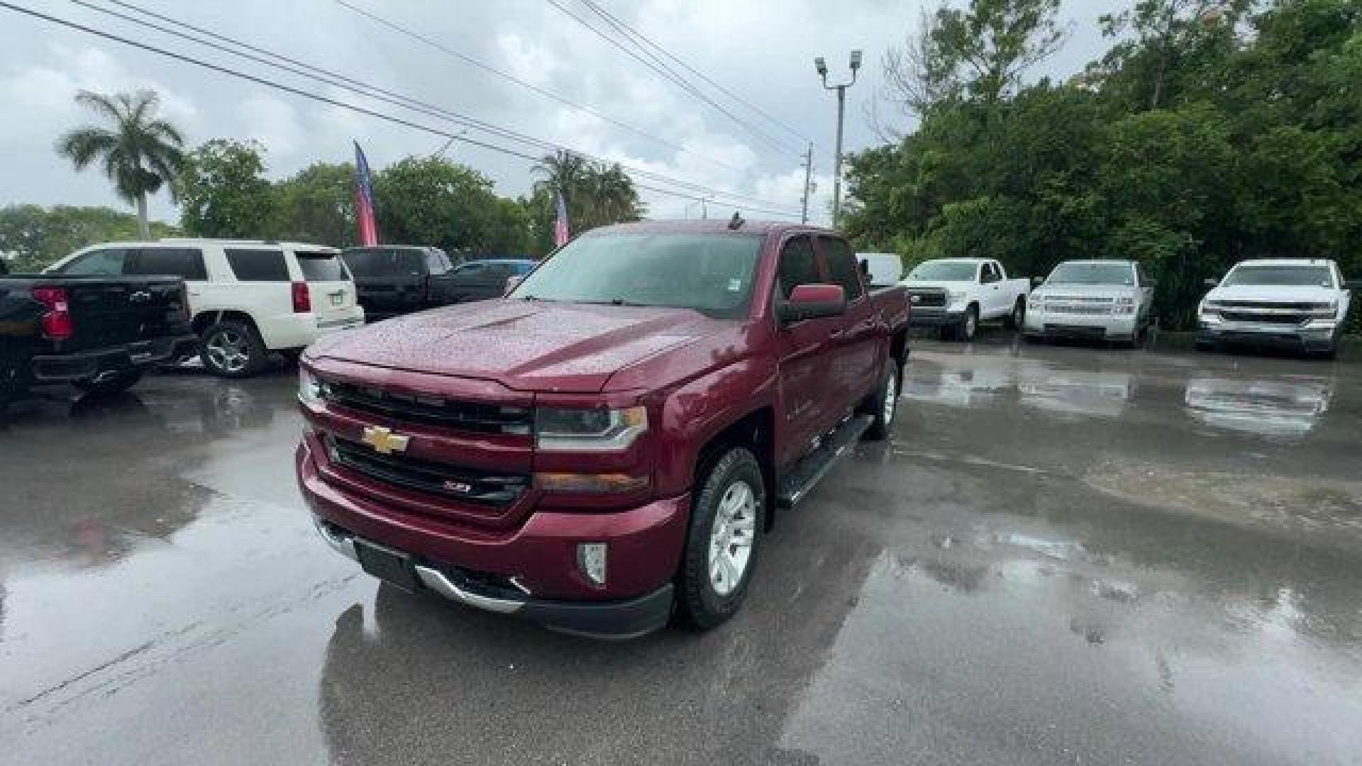 2016 Siren Red Tintcoat /Jet Black Chevrolet Silverado 1500 LT (3GCUKREC8GG) with an 8 5.3L engine, Automatic transmission, located at 27610 S Dixie Hwy, Homestead, FL, 33032, (305) 749-2348, 25.510241, -80.438301 - Boasts 22 Highway MPG and 16 City MPG! This Chevrolet Silverado 1500 delivers a Gas/Ethanol V8 5.3L/325 engine powering this Automatic transmission. WHEELS, 18 X 8.5 (45.7 CM X 21.6 CM) BRIGHT-MACHINED ALUMINUM (STD), WHEEL, FULL-SIZE SPARE, 17 (43.2 CM) STEEL, TRANSMISSION, 6-SPEED AUTOMATIC, ELECT - Photo#0