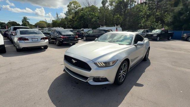 2017 Silver Ford Mustang EcoBoost Premium (1FA6P8TH2H5) with an 4 2.3 L engine, Automatic transmission, located at 27610 S Dixie Hwy, Homestead, FL, 33032, (305) 749-2348, 25.510241, -80.438301 - KBB.com 10 Coolest Cars Under $25,000. Scores 30 Highway MPG and 21 City MPG! This Ford Mustang boasts a Intercooled Turbo Premium Unleaded I-4 2.3 L/140 engine powering this Automatic transmission. ENGINE: 2.3L ECOBOOST (STD), Wireless Phone Connectivity, Wheels: 18 x 8 Magnetic Painted/Machined -i - Photo#0