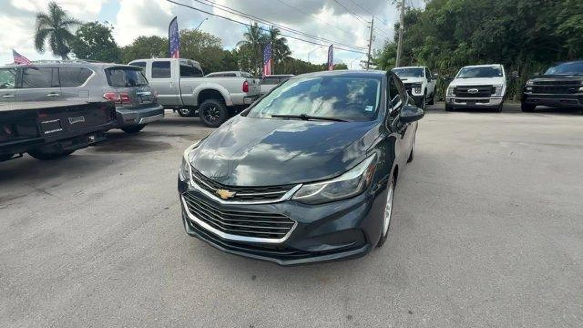 2018 Graphite Metallic /Jet Black Chevrolet Cruze LT (3G1BE6SM0JS) with an 4 1.4L engine, Automatic transmission, located at 27610 S Dixie Hwy, Homestead, FL, 33032, (305) 749-2348, 25.510241, -80.438301 - KBB.com 10 Most Awarded Brands. Scores 38 Highway MPG and 29 City MPG! This Chevrolet Cruze boasts a Turbocharged Gas I4 1.4L/ engine powering this Automatic transmission. WHEELS, 16 (40.6 CM) ALUMINUM (STD), VISORS, DRIVER AND FRONT PASSENGER ILLUMINATED VANITY MIRRORS, TRANSMISSION, 6-SPEED AUTOMA - Photo#0