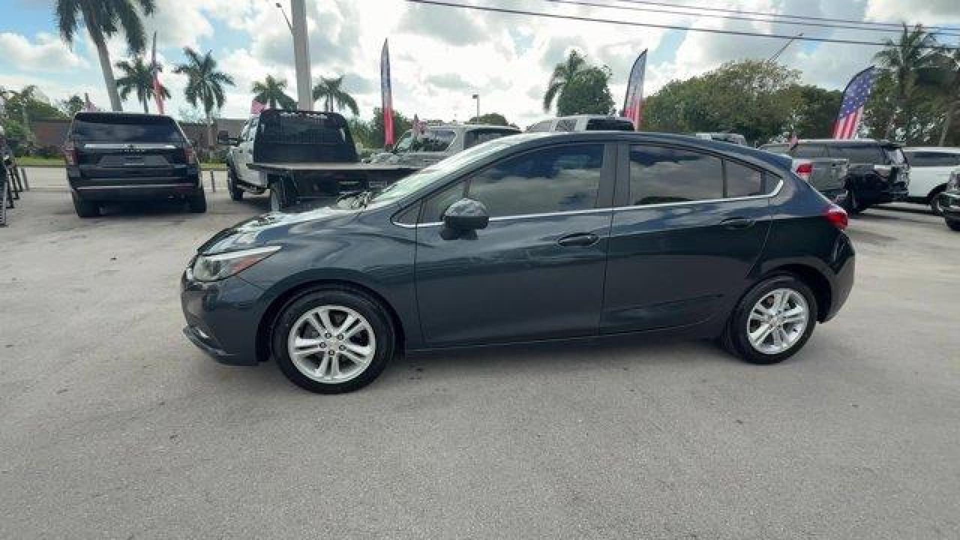 2018 Graphite Metallic /Jet Black Chevrolet Cruze LT (3G1BE6SM0JS) with an 4 1.4L engine, Automatic transmission, located at 27610 S Dixie Hwy, Homestead, FL, 33032, (305) 749-2348, 25.510241, -80.438301 - KBB.com 10 Most Awarded Brands. Scores 38 Highway MPG and 29 City MPG! This Chevrolet Cruze boasts a Turbocharged Gas I4 1.4L/ engine powering this Automatic transmission. WHEELS, 16 (40.6 CM) ALUMINUM (STD), VISORS, DRIVER AND FRONT PASSENGER ILLUMINATED VANITY MIRRORS, TRANSMISSION, 6-SPEED AUTOMA - Photo#1