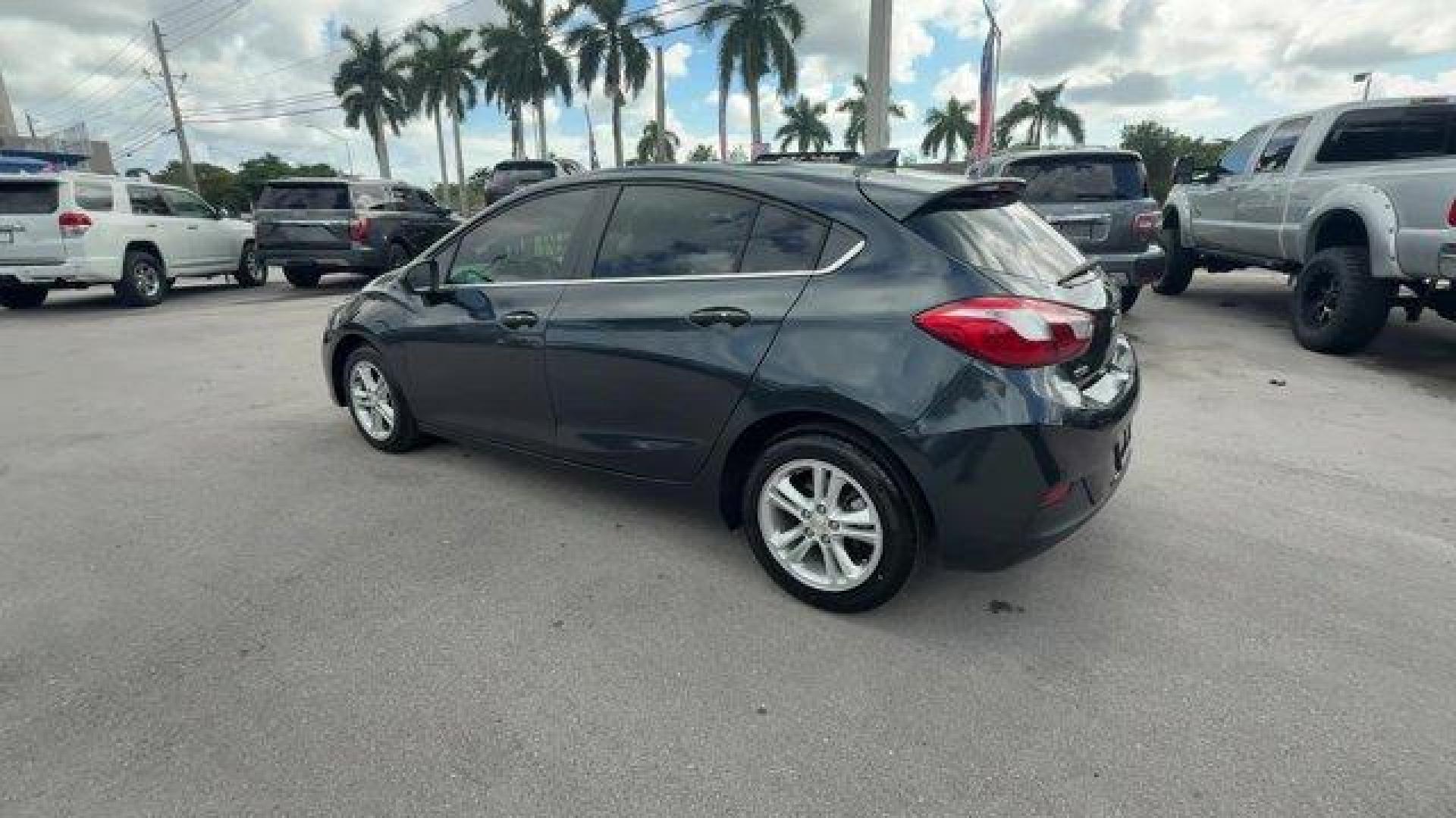 2018 Graphite Metallic /Jet Black Chevrolet Cruze LT (3G1BE6SM0JS) with an 4 1.4L engine, Automatic transmission, located at 27610 S Dixie Hwy, Homestead, FL, 33032, (305) 749-2348, 25.510241, -80.438301 - KBB.com 10 Most Awarded Brands. Scores 38 Highway MPG and 29 City MPG! This Chevrolet Cruze boasts a Turbocharged Gas I4 1.4L/ engine powering this Automatic transmission. WHEELS, 16 (40.6 CM) ALUMINUM (STD), VISORS, DRIVER AND FRONT PASSENGER ILLUMINATED VANITY MIRRORS, TRANSMISSION, 6-SPEED AUTOMA - Photo#2