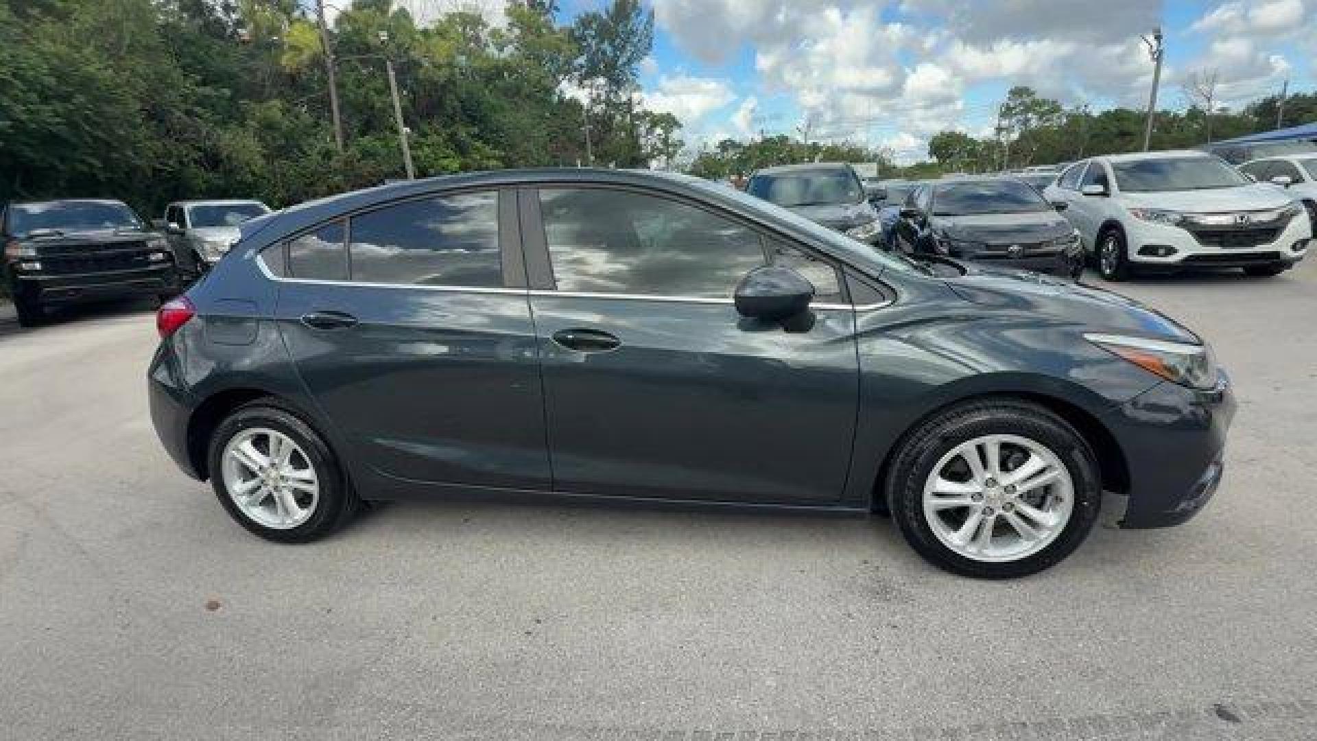 2018 Graphite Metallic /Jet Black Chevrolet Cruze LT (3G1BE6SM0JS) with an 4 1.4L engine, Automatic transmission, located at 27610 S Dixie Hwy, Homestead, FL, 33032, (305) 749-2348, 25.510241, -80.438301 - KBB.com 10 Most Awarded Brands. Scores 38 Highway MPG and 29 City MPG! This Chevrolet Cruze boasts a Turbocharged Gas I4 1.4L/ engine powering this Automatic transmission. WHEELS, 16 (40.6 CM) ALUMINUM (STD), VISORS, DRIVER AND FRONT PASSENGER ILLUMINATED VANITY MIRRORS, TRANSMISSION, 6-SPEED AUTOMA - Photo#5