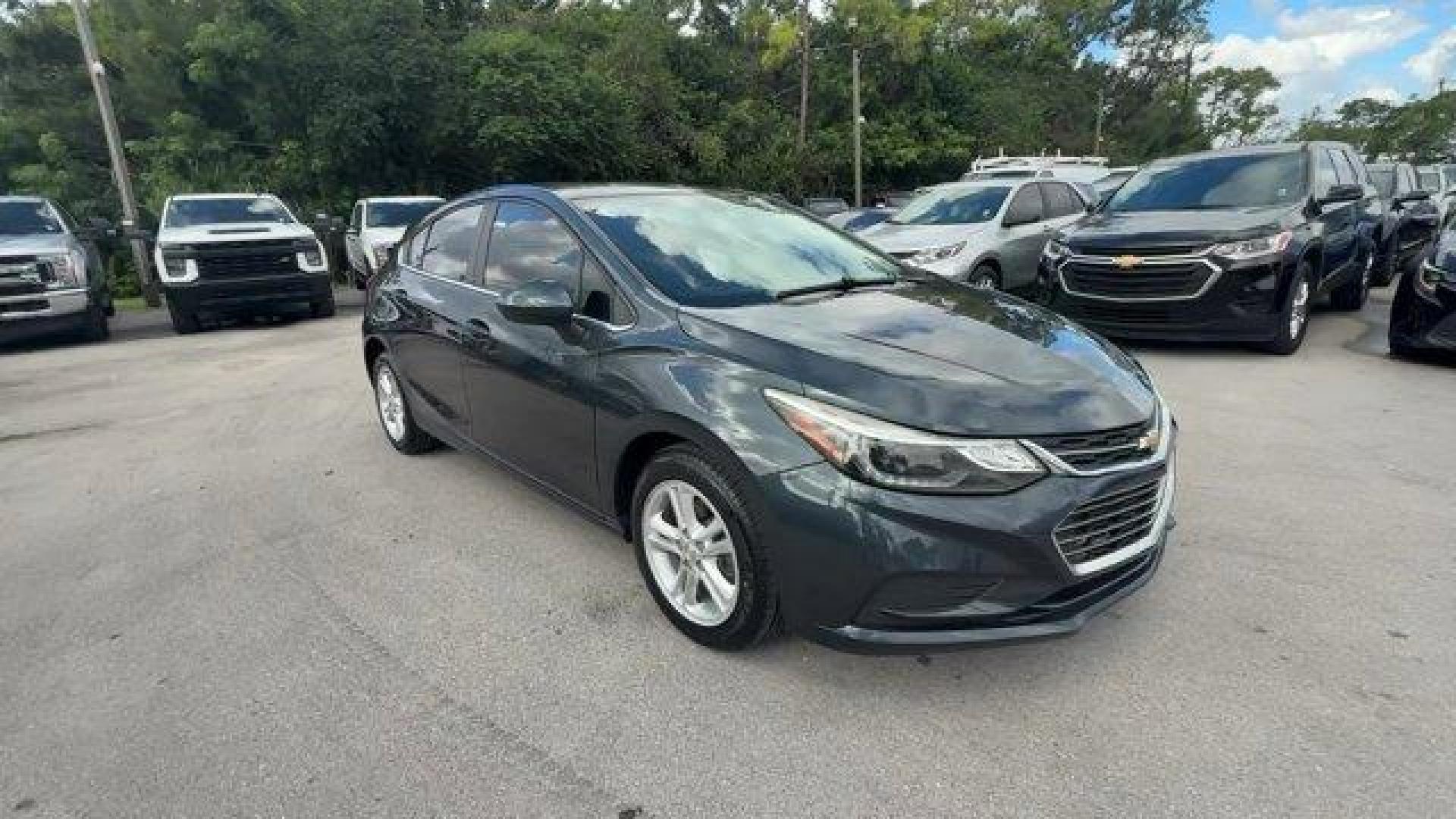 2018 Graphite Metallic /Jet Black Chevrolet Cruze LT (3G1BE6SM0JS) with an 4 1.4L engine, Automatic transmission, located at 27610 S Dixie Hwy, Homestead, FL, 33032, (305) 749-2348, 25.510241, -80.438301 - KBB.com 10 Most Awarded Brands. Scores 38 Highway MPG and 29 City MPG! This Chevrolet Cruze boasts a Turbocharged Gas I4 1.4L/ engine powering this Automatic transmission. WHEELS, 16 (40.6 CM) ALUMINUM (STD), VISORS, DRIVER AND FRONT PASSENGER ILLUMINATED VANITY MIRRORS, TRANSMISSION, 6-SPEED AUTOMA - Photo#6