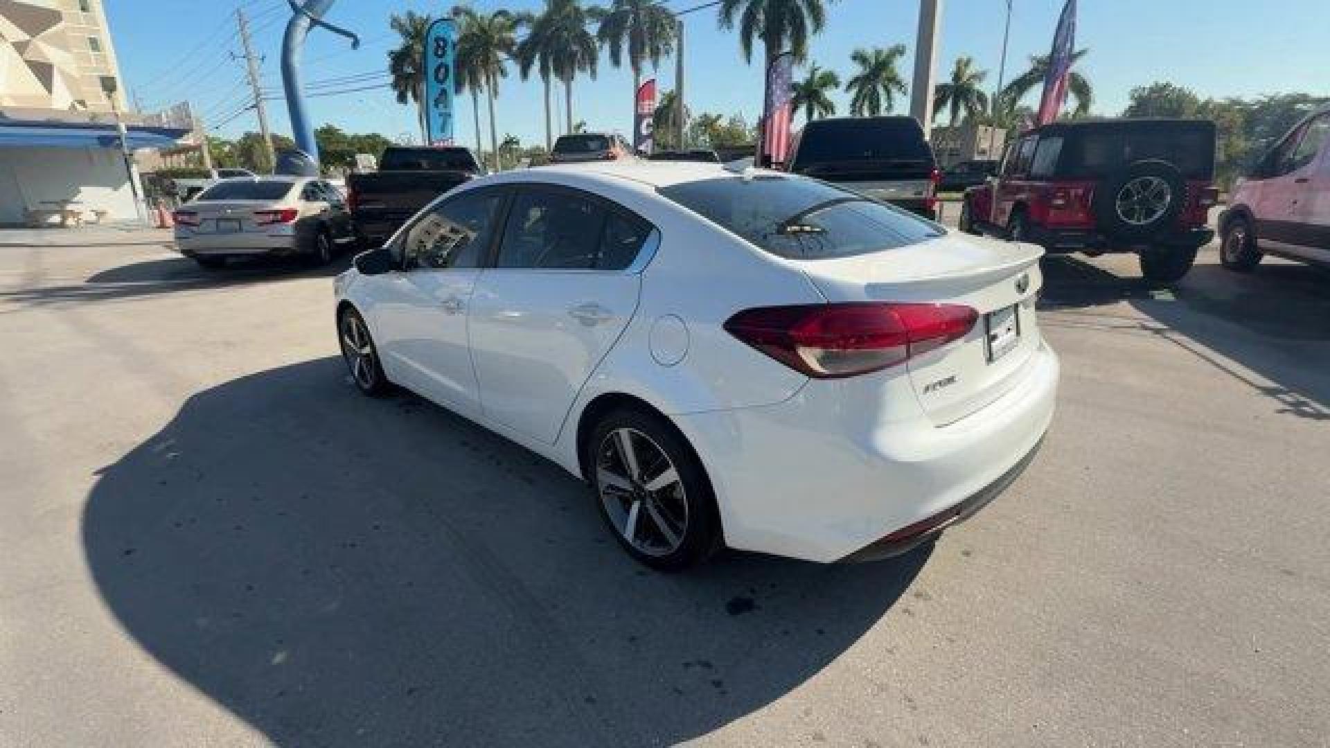 2017 Snow White Pearl /Black Kia Forte (3KPFL4A80HE) with an 4 2.0 L engine, Automatic transmission, located at 27610 S Dixie Hwy, Homestead, FL, 33032, (305) 749-2348, 25.510241, -80.438301 - KBB.com 10 Most Awarded Brands. Only 79,834 Miles! Scores 33 Highway MPG and 25 City MPG! This Kia Forte delivers a Regular Unleaded I-4 2.0 L/122 engine powering this Automatic transmission. SNOW WHITE PEARL, CARPETED FLOOR MATS, BLACK, LEATHER SEAT TRIM.*This Kia Forte Comes Equipped with These Op - Photo#2