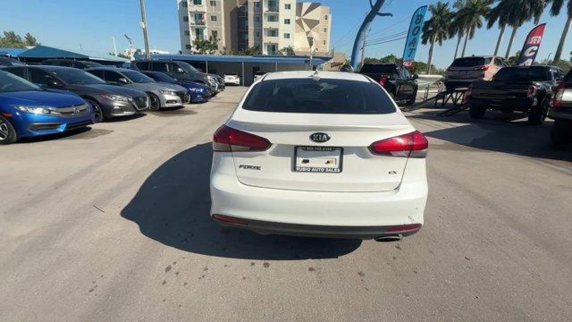 2017 Snow White Pearl /Black Kia Forte (3KPFL4A80HE) with an 4 2.0 L engine, Automatic transmission, located at 27610 S Dixie Hwy, Homestead, FL, 33032, (305) 749-2348, 25.510241, -80.438301 - KBB.com 10 Most Awarded Brands. Only 79,834 Miles! Scores 33 Highway MPG and 25 City MPG! This Kia Forte delivers a Regular Unleaded I-4 2.0 L/122 engine powering this Automatic transmission. SNOW WHITE PEARL, CARPETED FLOOR MATS, BLACK, LEATHER SEAT TRIM.*This Kia Forte Comes Equipped with These Op - Photo#3