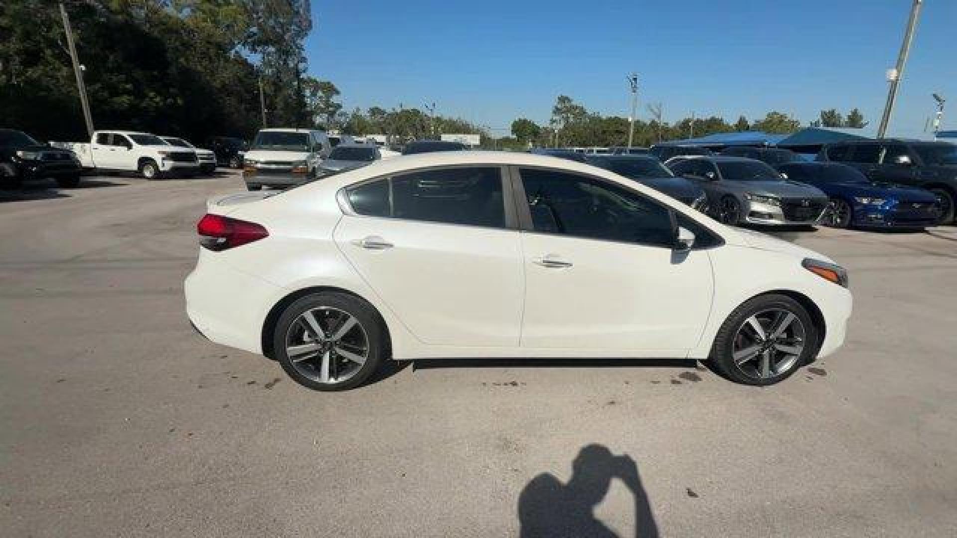 2017 Snow White Pearl /Black Kia Forte (3KPFL4A80HE) with an 4 2.0 L engine, Automatic transmission, located at 27610 S Dixie Hwy, Homestead, FL, 33032, (305) 749-2348, 25.510241, -80.438301 - KBB.com 10 Most Awarded Brands. Only 79,834 Miles! Scores 33 Highway MPG and 25 City MPG! This Kia Forte delivers a Regular Unleaded I-4 2.0 L/122 engine powering this Automatic transmission. SNOW WHITE PEARL, CARPETED FLOOR MATS, BLACK, LEATHER SEAT TRIM.*This Kia Forte Comes Equipped with These Op - Photo#5