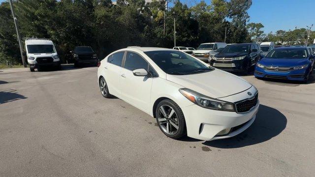2017 Snow White Pearl /Black Kia Forte (3KPFL4A80HE) with an 4 2.0 L engine, Automatic transmission, located at 27610 S Dixie Hwy, Homestead, FL, 33032, (305) 749-2348, 25.510241, -80.438301 - KBB.com 10 Most Awarded Brands. Only 79,834 Miles! Scores 33 Highway MPG and 25 City MPG! This Kia Forte delivers a Regular Unleaded I-4 2.0 L/122 engine powering this Automatic transmission. SNOW WHITE PEARL, CARPETED FLOOR MATS, BLACK, LEATHER SEAT TRIM.*This Kia Forte Comes Equipped with These Op - Photo#6