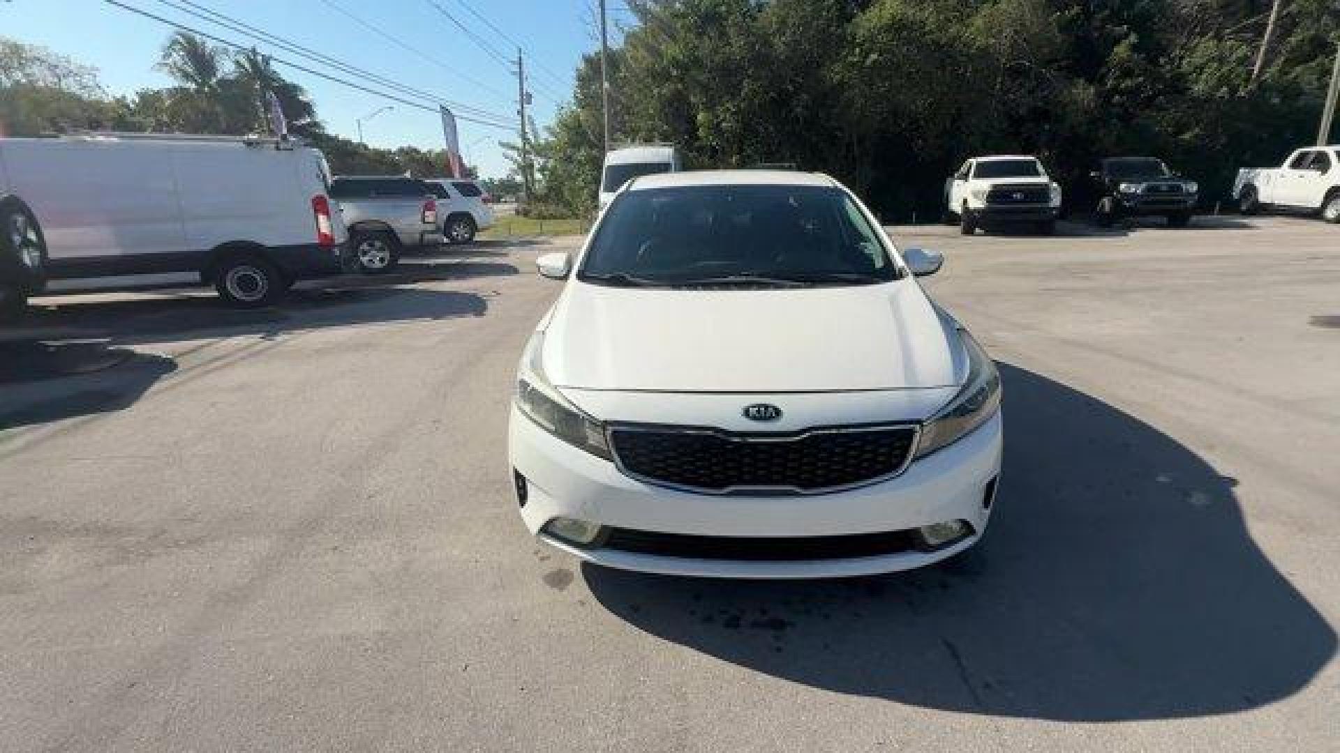 2017 Snow White Pearl /Black Kia Forte (3KPFL4A80HE) with an 4 2.0 L engine, Automatic transmission, located at 27610 S Dixie Hwy, Homestead, FL, 33032, (305) 749-2348, 25.510241, -80.438301 - KBB.com 10 Most Awarded Brands. Only 79,834 Miles! Scores 33 Highway MPG and 25 City MPG! This Kia Forte delivers a Regular Unleaded I-4 2.0 L/122 engine powering this Automatic transmission. SNOW WHITE PEARL, CARPETED FLOOR MATS, BLACK, LEATHER SEAT TRIM.*This Kia Forte Comes Equipped with These Op - Photo#7
