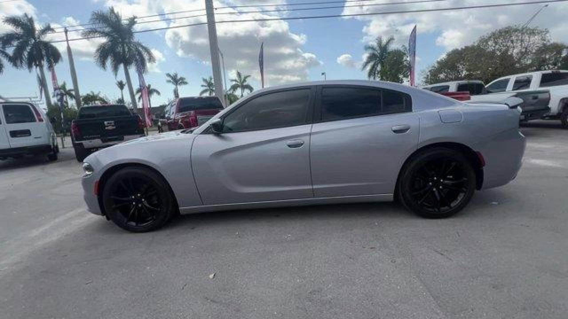 2016 Billet Clearcoat /Black Dodge Charger (2C3CDXBG4GH) with an 6 3.6 L engine, Automatic transmission, located at 27610 S Dixie Hwy, Homestead, FL, 33032, (305) 749-2348, 25.510241, -80.438301 - KBB.com 10 Best Used Cars Under $20,000. Only 69,245 Miles! Delivers 31 Highway MPG and 19 City MPG! This Dodge Charger delivers a Regular Unleaded V-6 3.6 L/220 engine powering this Automatic transmission. WHEELS: 20 X 8.0 GLOSS BLACK PAINTED ALUMINUM, TRANSMISSION: 8-SPEED AUTO (8HP45) (STD), TIRE - Photo#1