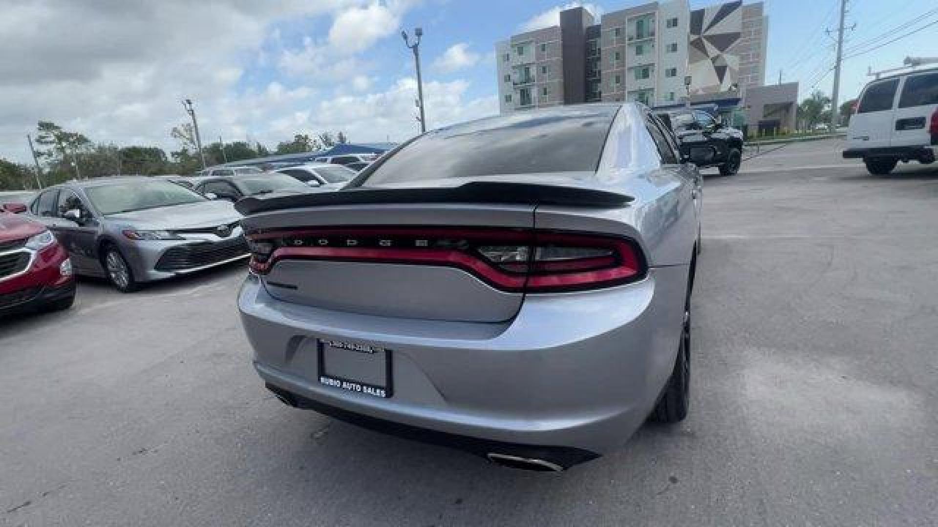 2016 Billet Clearcoat /Black Dodge Charger (2C3CDXBG4GH) with an 6 3.6 L engine, Automatic transmission, located at 27610 S Dixie Hwy, Homestead, FL, 33032, (305) 749-2348, 25.510241, -80.438301 - KBB.com 10 Best Used Cars Under $20,000. Only 69,245 Miles! Delivers 31 Highway MPG and 19 City MPG! This Dodge Charger delivers a Regular Unleaded V-6 3.6 L/220 engine powering this Automatic transmission. WHEELS: 20 X 8.0 GLOSS BLACK PAINTED ALUMINUM, TRANSMISSION: 8-SPEED AUTO (8HP45) (STD), TIRE - Photo#4