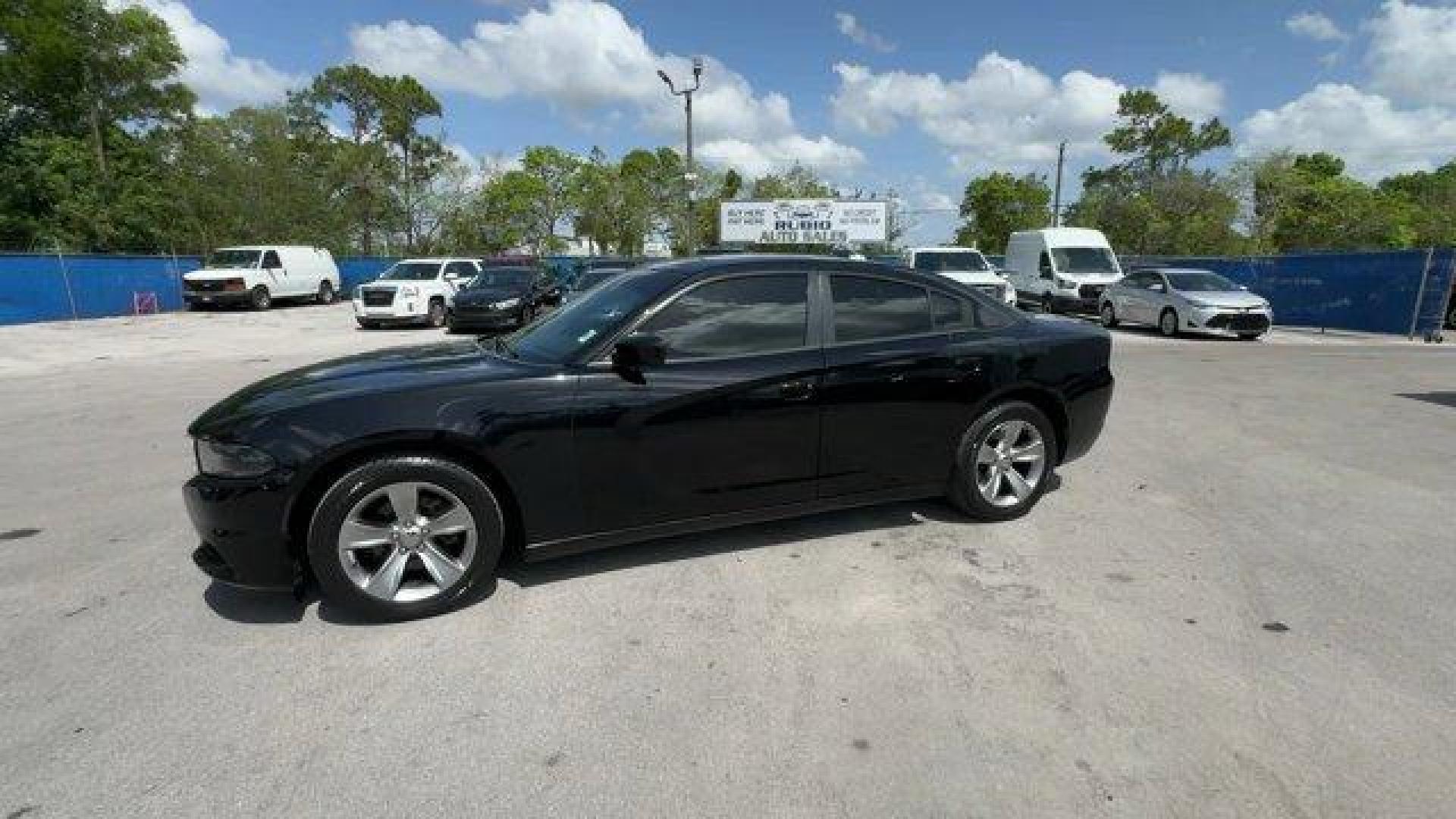 2016 Pitch Black Clearcoat /Black Dodge Charger (2C3CDXHG3GH) with an 6 3.6 L engine, Automatic transmission, located at 27610 S Dixie Hwy, Homestead, FL, 33032, (305) 749-2348, 25.510241, -80.438301 - KBB.com 10 Best Used Cars Under $20,000. Boasts 31 Highway MPG and 19 City MPG! This Dodge Charger boasts a Regular Unleaded V-6 3.6 L/220 engine powering this Automatic transmission. WHEELS: 18 X 7.5 CAST ALUMINUM (STD), TRANSMISSION: 8-SPEED AUTO (8HP45) (STD), TIRES: P235/55R18 AS PERFORMANCE (ST - Photo#1