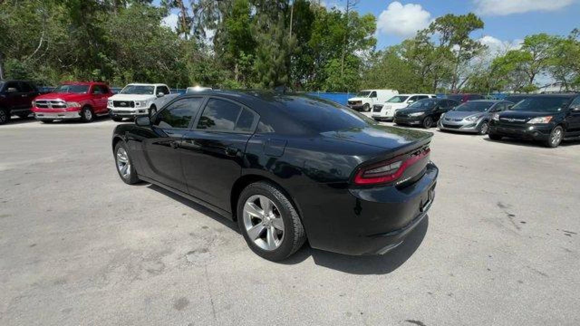 2016 Pitch Black Clearcoat /Black Dodge Charger (2C3CDXHG3GH) with an 6 3.6 L engine, Automatic transmission, located at 27610 S Dixie Hwy, Homestead, FL, 33032, (305) 749-2348, 25.510241, -80.438301 - KBB.com 10 Best Used Cars Under $20,000. Boasts 31 Highway MPG and 19 City MPG! This Dodge Charger boasts a Regular Unleaded V-6 3.6 L/220 engine powering this Automatic transmission. WHEELS: 18 X 7.5 CAST ALUMINUM (STD), TRANSMISSION: 8-SPEED AUTO (8HP45) (STD), TIRES: P235/55R18 AS PERFORMANCE (ST - Photo#2
