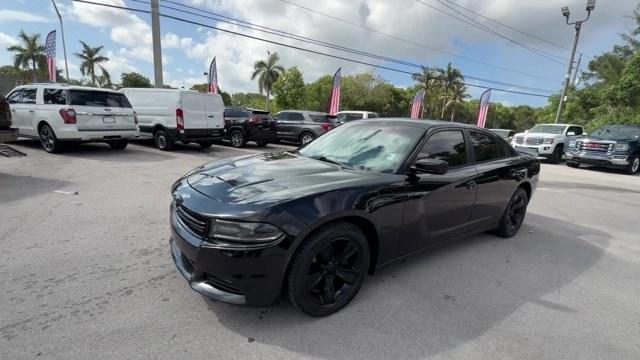 2016 Pitch Black Clearcoat /Black Dodge Charger (2C3CDXHG3GH) with an 6 3.6 L engine, Automatic transmission, located at 27610 S Dixie Hwy, Homestead, FL, 33032, (305) 749-2348, 25.510241, -80.438301 - KBB.com 10 Best Used Cars Under $20,000. Boasts 31 Highway MPG and 19 City MPG! This Dodge Charger boasts a Regular Unleaded V-6 3.6 L/220 engine powering this Automatic transmission. WHEELS: 18 X 7.5 CAST ALUMINUM (STD), TRANSMISSION: 8-SPEED AUTO (8HP45) (STD), TIRES: P235/55R18 AS PERFORMANCE (ST- Photo#0