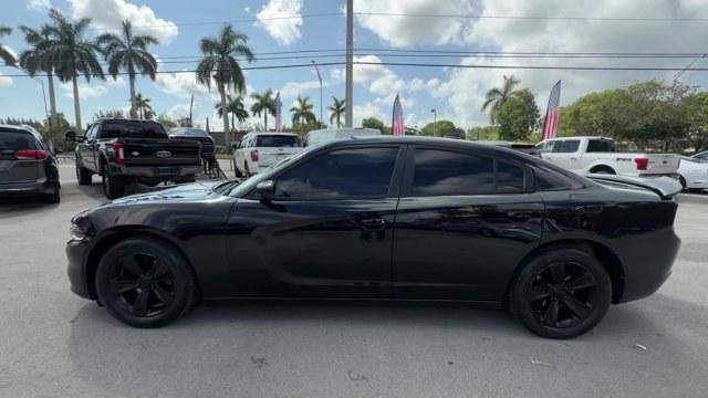 2016 Pitch Black Clearcoat /Black Dodge Charger (2C3CDXHG3GH) with an 6 3.6 L engine, Automatic transmission, located at 27610 S Dixie Hwy, Homestead, FL, 33032, (305) 749-2348, 25.510241, -80.438301 - KBB.com 10 Best Used Cars Under $20,000. Boasts 31 Highway MPG and 19 City MPG! This Dodge Charger boasts a Regular Unleaded V-6 3.6 L/220 engine powering this Automatic transmission. WHEELS: 18 X 7.5 CAST ALUMINUM (STD), TRANSMISSION: 8-SPEED AUTO (8HP45) (STD), TIRES: P235/55R18 AS PERFORMANCE (ST- Photo#1