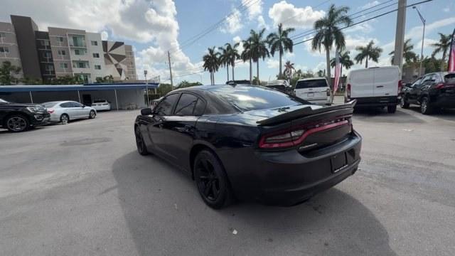 2016 Pitch Black Clearcoat /Black Dodge Charger (2C3CDXHG3GH) with an 6 3.6 L engine, Automatic transmission, located at 27610 S Dixie Hwy, Homestead, FL, 33032, (305) 749-2348, 25.510241, -80.438301 - KBB.com 10 Best Used Cars Under $20,000. Boasts 31 Highway MPG and 19 City MPG! This Dodge Charger boasts a Regular Unleaded V-6 3.6 L/220 engine powering this Automatic transmission. WHEELS: 18 X 7.5 CAST ALUMINUM (STD), TRANSMISSION: 8-SPEED AUTO (8HP45) (STD), TIRES: P235/55R18 AS PERFORMANCE (ST- Photo#2