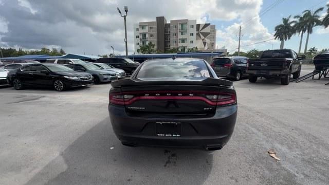 2016 Pitch Black Clearcoat /Black Dodge Charger (2C3CDXHG3GH) with an 6 3.6 L engine, Automatic transmission, located at 27610 S Dixie Hwy, Homestead, FL, 33032, (305) 749-2348, 25.510241, -80.438301 - KBB.com 10 Best Used Cars Under $20,000. Boasts 31 Highway MPG and 19 City MPG! This Dodge Charger boasts a Regular Unleaded V-6 3.6 L/220 engine powering this Automatic transmission. WHEELS: 18 X 7.5 CAST ALUMINUM (STD), TRANSMISSION: 8-SPEED AUTO (8HP45) (STD), TIRES: P235/55R18 AS PERFORMANCE (ST- Photo#3