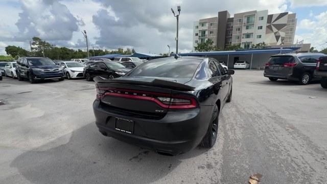 2016 Pitch Black Clearcoat /Black Dodge Charger (2C3CDXHG3GH) with an 6 3.6 L engine, Automatic transmission, located at 27610 S Dixie Hwy, Homestead, FL, 33032, (305) 749-2348, 25.510241, -80.438301 - KBB.com 10 Best Used Cars Under $20,000. Boasts 31 Highway MPG and 19 City MPG! This Dodge Charger boasts a Regular Unleaded V-6 3.6 L/220 engine powering this Automatic transmission. WHEELS: 18 X 7.5 CAST ALUMINUM (STD), TRANSMISSION: 8-SPEED AUTO (8HP45) (STD), TIRES: P235/55R18 AS PERFORMANCE (ST- Photo#4
