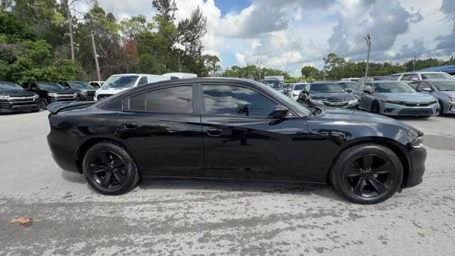 2016 Pitch Black Clearcoat /Black Dodge Charger (2C3CDXHG3GH) with an 6 3.6 L engine, Automatic transmission, located at 27610 S Dixie Hwy, Homestead, FL, 33032, (305) 749-2348, 25.510241, -80.438301 - KBB.com 10 Best Used Cars Under $20,000. Boasts 31 Highway MPG and 19 City MPG! This Dodge Charger boasts a Regular Unleaded V-6 3.6 L/220 engine powering this Automatic transmission. WHEELS: 18 X 7.5 CAST ALUMINUM (STD), TRANSMISSION: 8-SPEED AUTO (8HP45) (STD), TIRES: P235/55R18 AS PERFORMANCE (ST- Photo#5