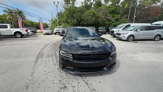 2016 Pitch Black Clearcoat /Black Dodge Charger (2C3CDXHG3GH) with an 6 3.6 L engine, Automatic transmission, located at 27610 S Dixie Hwy, Homestead, FL, 33032, (305) 749-2348, 25.510241, -80.438301 - KBB.com 10 Best Used Cars Under $20,000. Boasts 31 Highway MPG and 19 City MPG! This Dodge Charger boasts a Regular Unleaded V-6 3.6 L/220 engine powering this Automatic transmission. WHEELS: 18 X 7.5 CAST ALUMINUM (STD), TRANSMISSION: 8-SPEED AUTO (8HP45) (STD), TIRES: P235/55R18 AS PERFORMANCE (ST- Photo#7