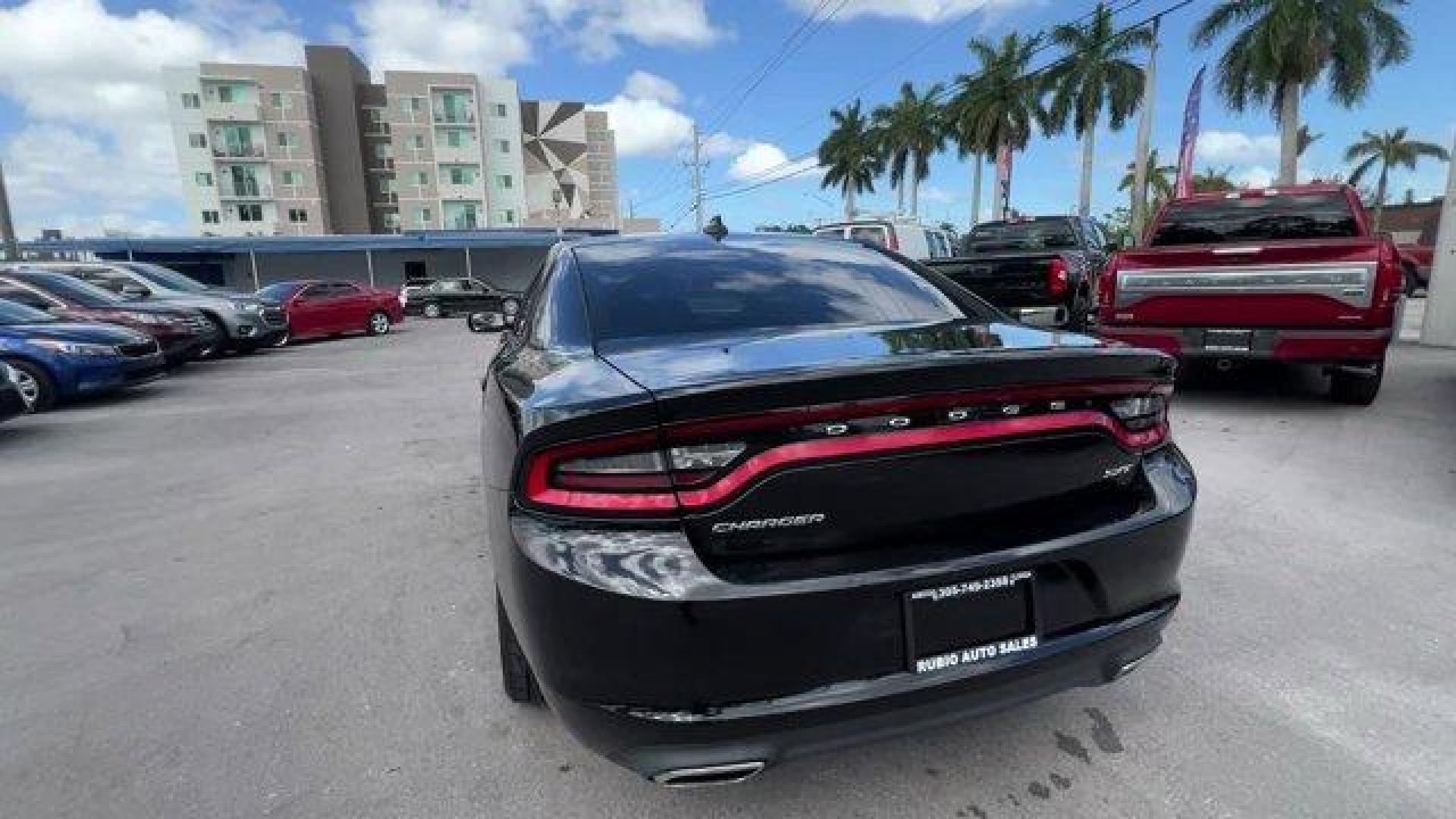 2016 Pitch Black Clearcoat /Black Dodge Charger (2C3CDXHG3GH) with an 6 3.6 L engine, Automatic transmission, located at 27610 S Dixie Hwy, Homestead, FL, 33032, (305) 749-2348, 25.510241, -80.438301 - KBB.com 10 Best Used Cars Under $20,000. Boasts 31 Highway MPG and 19 City MPG! This Dodge Charger boasts a Regular Unleaded V-6 3.6 L/220 engine powering this Automatic transmission. WHEELS: 18 X 7.5 CAST ALUMINUM (STD), TRANSMISSION: 8-SPEED AUTO (8HP45) (STD), TIRES: P235/55R18 AS PERFORMANCE (ST - Photo#2