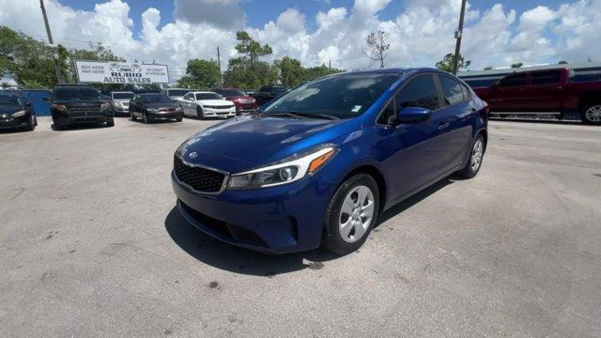 2018 Deep Sea Blue /Black Kia Forte (3KPFK4A74JE) with an 4 2.0 L engine, Automatic transmission, located at 27610 S Dixie Hwy, Homestead, FL, 33032, (305) 749-2348, 25.510241, -80.438301 - Scores 37 Highway MPG and 29 City MPG! This Kia Forte delivers a Regular Unleaded I-4 2.0 L/122 engine powering this Automatic transmission. DEEP SEA BLUE, CARPETED FLOOR MATS, BLACK, PREMIUM CLOTH SEAT TRIM.* This Kia Forte Features the Following Options *BLACK, CLOTH SEAT TRIM, Window Grid Antenna - Photo#0