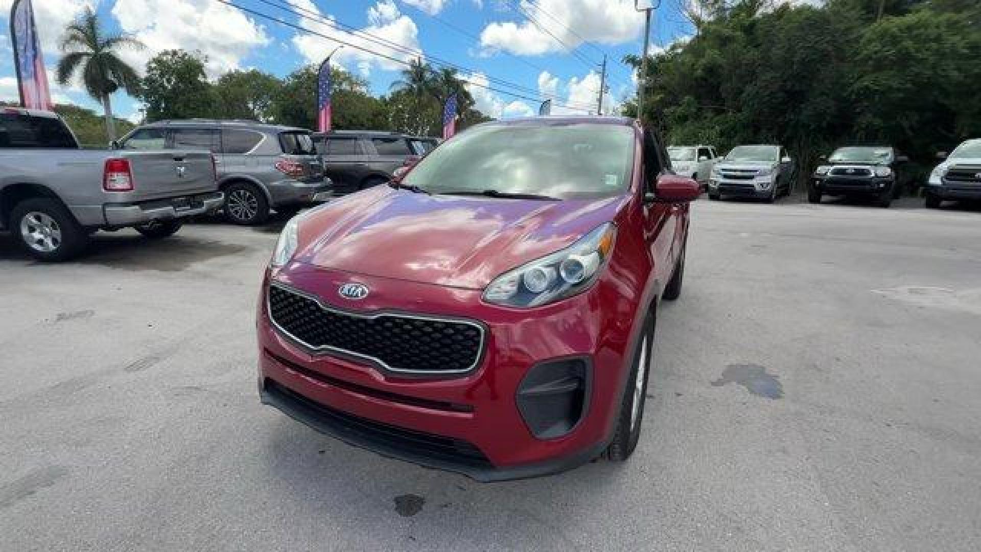 2017 Hyper Red /Black Kia Sportage (KNDPM3AC6H7) with an 4 2.4 L engine, Automatic transmission, located at 27610 S Dixie Hwy, Homestead, FL, 33032, (305) 749-2348, 25.510241, -80.438301 - IIHS Top Safety Pick, Top Safety Pick+. Delivers 30 Highway MPG and 23 City MPG! This Kia Sportage boasts a Regular Unleaded I-4 2.4 L/144 engine powering this Automatic transmission. WHEEL LOCKS, HYPER RED, CARPET FLOOR MATS.* This Kia Sportage Features the Following Options *BLACK, CLOTH SEAT TRIM - Photo#0