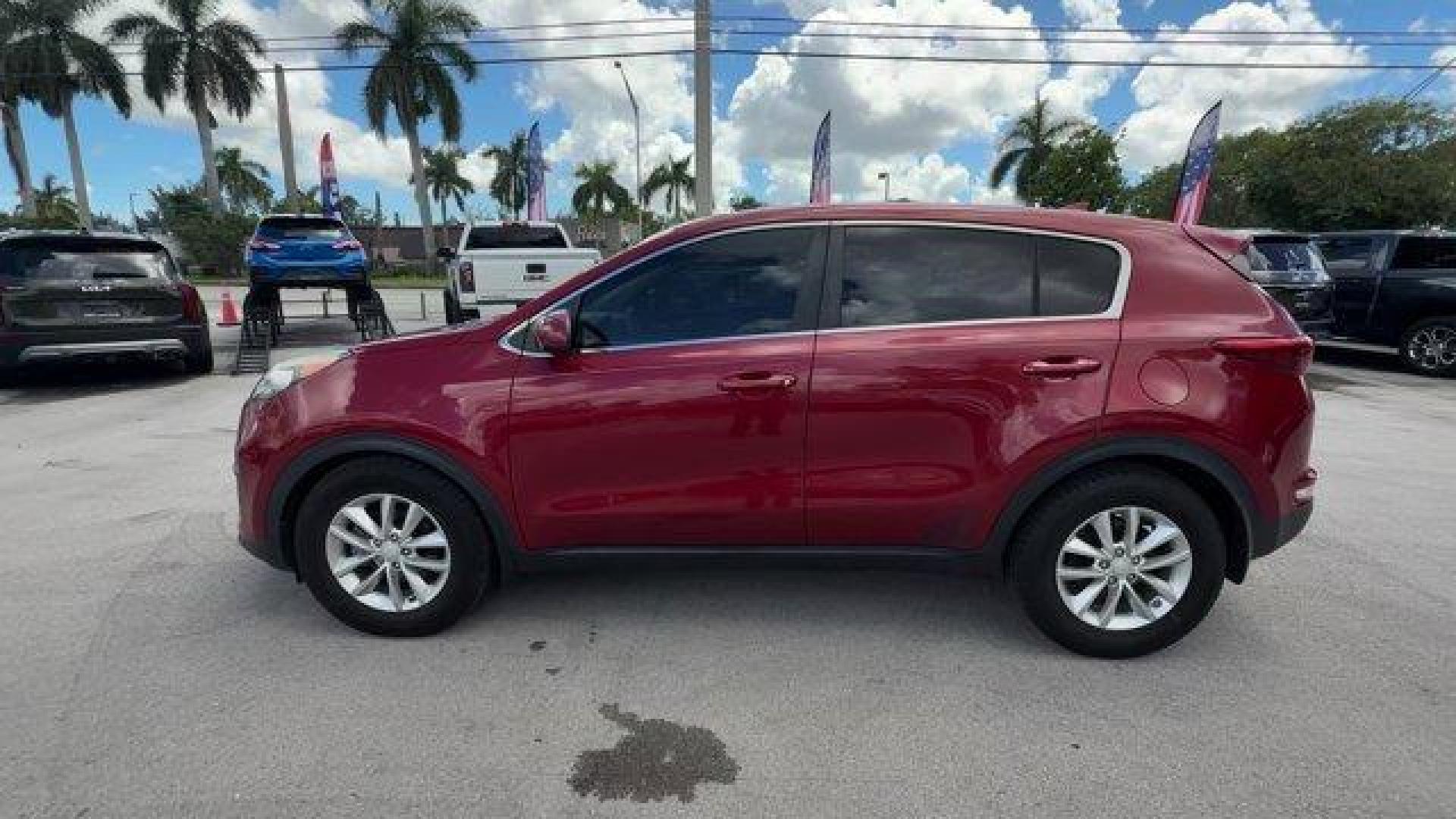 2017 Hyper Red /Black Kia Sportage (KNDPM3AC6H7) with an 4 2.4 L engine, Automatic transmission, located at 27610 S Dixie Hwy, Homestead, FL, 33032, (305) 749-2348, 25.510241, -80.438301 - IIHS Top Safety Pick, Top Safety Pick+. Delivers 30 Highway MPG and 23 City MPG! This Kia Sportage boasts a Regular Unleaded I-4 2.4 L/144 engine powering this Automatic transmission. WHEEL LOCKS, HYPER RED, CARPET FLOOR MATS.* This Kia Sportage Features the Following Options *BLACK, CLOTH SEAT TRIM - Photo#1