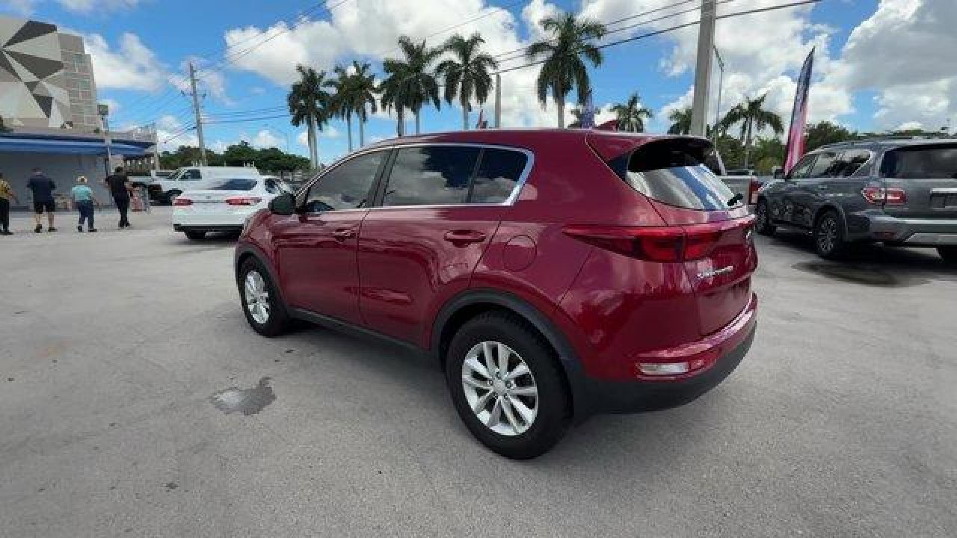 2017 Hyper Red /Black Kia Sportage (KNDPM3AC6H7) with an 4 2.4 L engine, Automatic transmission, located at 27610 S Dixie Hwy, Homestead, FL, 33032, (305) 749-2348, 25.510241, -80.438301 - IIHS Top Safety Pick, Top Safety Pick+. Delivers 30 Highway MPG and 23 City MPG! This Kia Sportage boasts a Regular Unleaded I-4 2.4 L/144 engine powering this Automatic transmission. WHEEL LOCKS, HYPER RED, CARPET FLOOR MATS.* This Kia Sportage Features the Following Options *BLACK, CLOTH SEAT TRIM - Photo#2