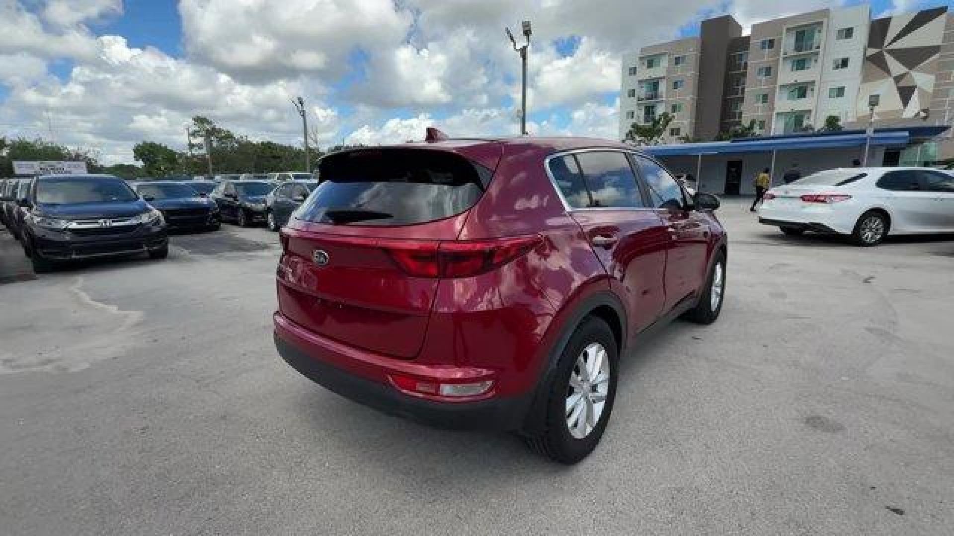 2017 Hyper Red /Black Kia Sportage (KNDPM3AC6H7) with an 4 2.4 L engine, Automatic transmission, located at 27610 S Dixie Hwy, Homestead, FL, 33032, (305) 749-2348, 25.510241, -80.438301 - IIHS Top Safety Pick, Top Safety Pick+. Delivers 30 Highway MPG and 23 City MPG! This Kia Sportage boasts a Regular Unleaded I-4 2.4 L/144 engine powering this Automatic transmission. WHEEL LOCKS, HYPER RED, CARPET FLOOR MATS.* This Kia Sportage Features the Following Options *BLACK, CLOTH SEAT TRIM - Photo#4