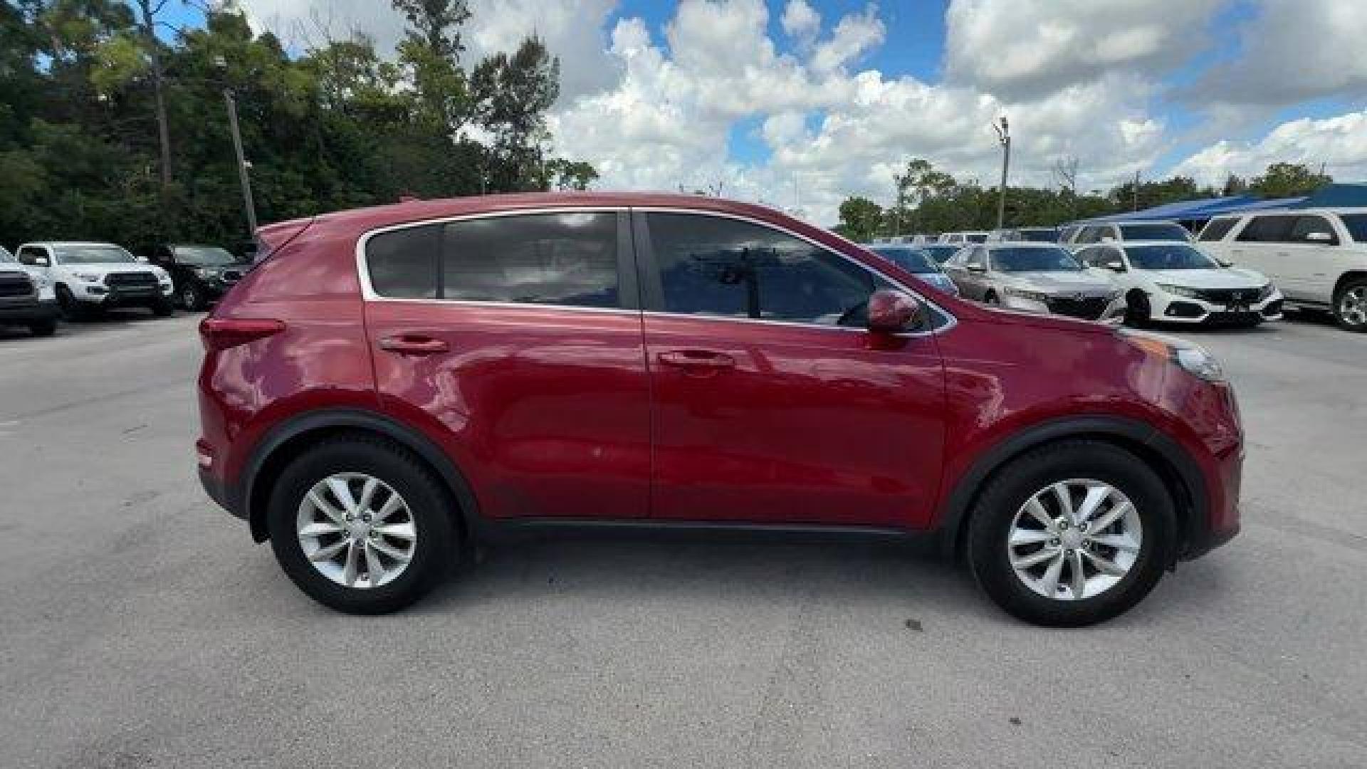 2017 Hyper Red /Black Kia Sportage (KNDPM3AC6H7) with an 4 2.4 L engine, Automatic transmission, located at 27610 S Dixie Hwy, Homestead, FL, 33032, (305) 749-2348, 25.510241, -80.438301 - IIHS Top Safety Pick, Top Safety Pick+. Delivers 30 Highway MPG and 23 City MPG! This Kia Sportage boasts a Regular Unleaded I-4 2.4 L/144 engine powering this Automatic transmission. WHEEL LOCKS, HYPER RED, CARPET FLOOR MATS.* This Kia Sportage Features the Following Options *BLACK, CLOTH SEAT TRIM - Photo#5