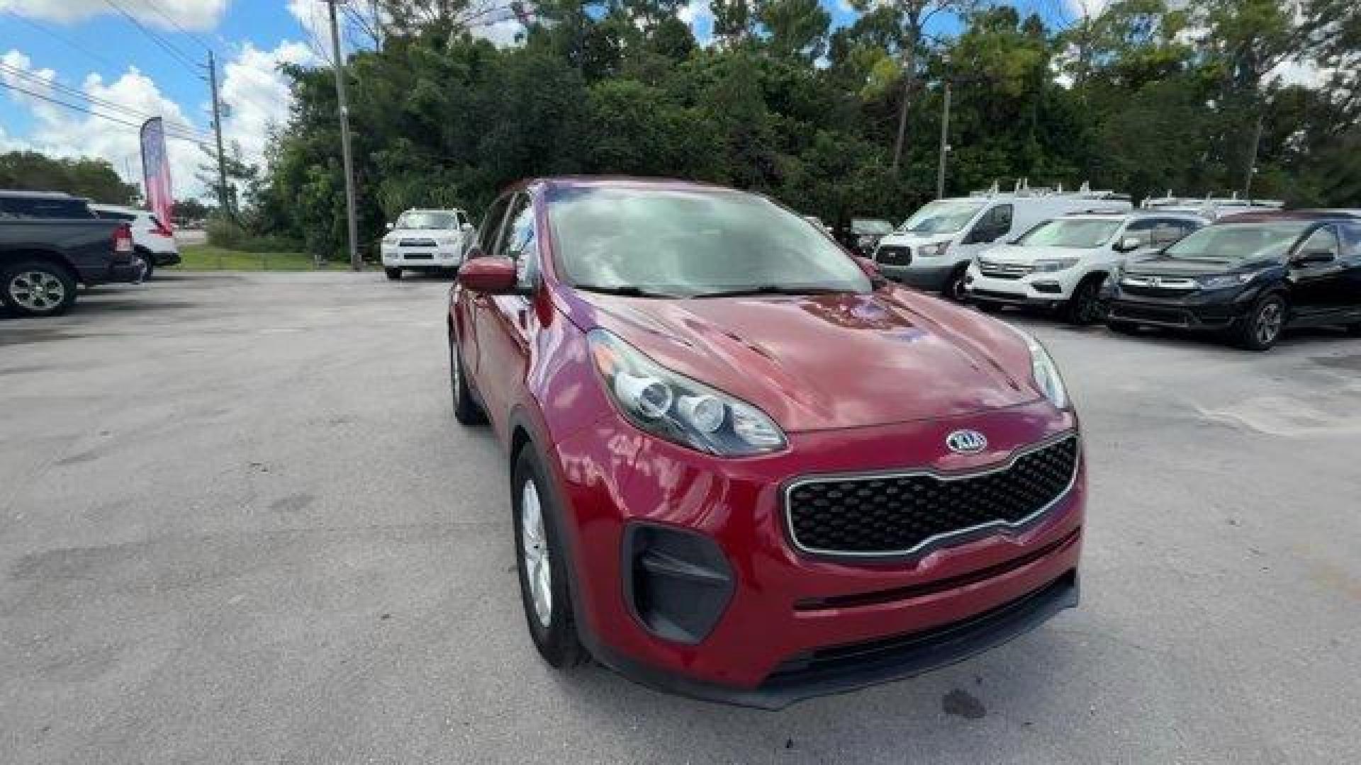 2017 Hyper Red /Black Kia Sportage (KNDPM3AC6H7) with an 4 2.4 L engine, Automatic transmission, located at 27610 S Dixie Hwy, Homestead, FL, 33032, (305) 749-2348, 25.510241, -80.438301 - IIHS Top Safety Pick, Top Safety Pick+. Delivers 30 Highway MPG and 23 City MPG! This Kia Sportage boasts a Regular Unleaded I-4 2.4 L/144 engine powering this Automatic transmission. WHEEL LOCKS, HYPER RED, CARPET FLOOR MATS.* This Kia Sportage Features the Following Options *BLACK, CLOTH SEAT TRIM - Photo#6