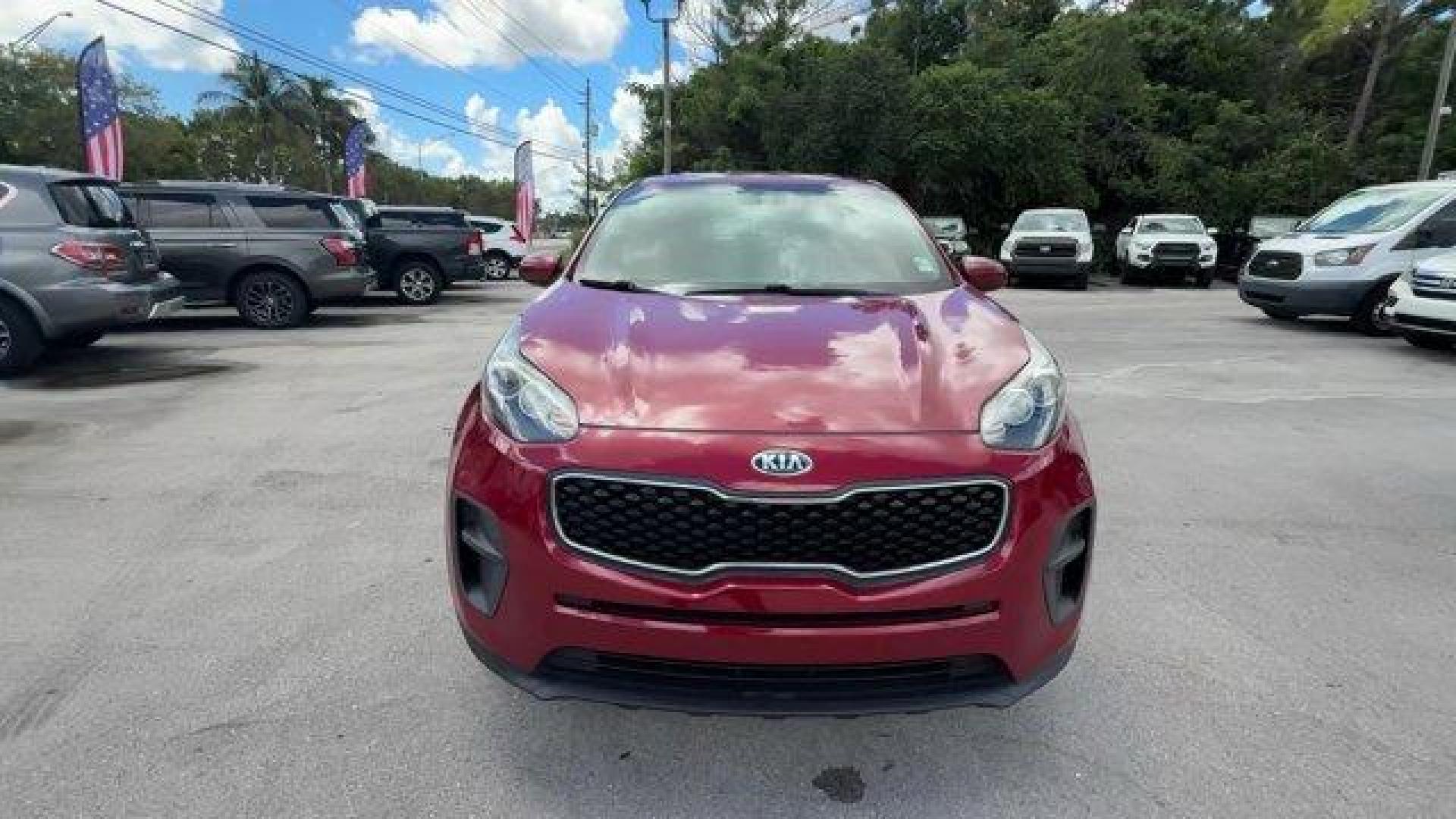 2017 Hyper Red /Black Kia Sportage (KNDPM3AC6H7) with an 4 2.4 L engine, Automatic transmission, located at 27610 S Dixie Hwy, Homestead, FL, 33032, (305) 749-2348, 25.510241, -80.438301 - IIHS Top Safety Pick, Top Safety Pick+. Delivers 30 Highway MPG and 23 City MPG! This Kia Sportage boasts a Regular Unleaded I-4 2.4 L/144 engine powering this Automatic transmission. WHEEL LOCKS, HYPER RED, CARPET FLOOR MATS.* This Kia Sportage Features the Following Options *BLACK, CLOTH SEAT TRIM - Photo#7