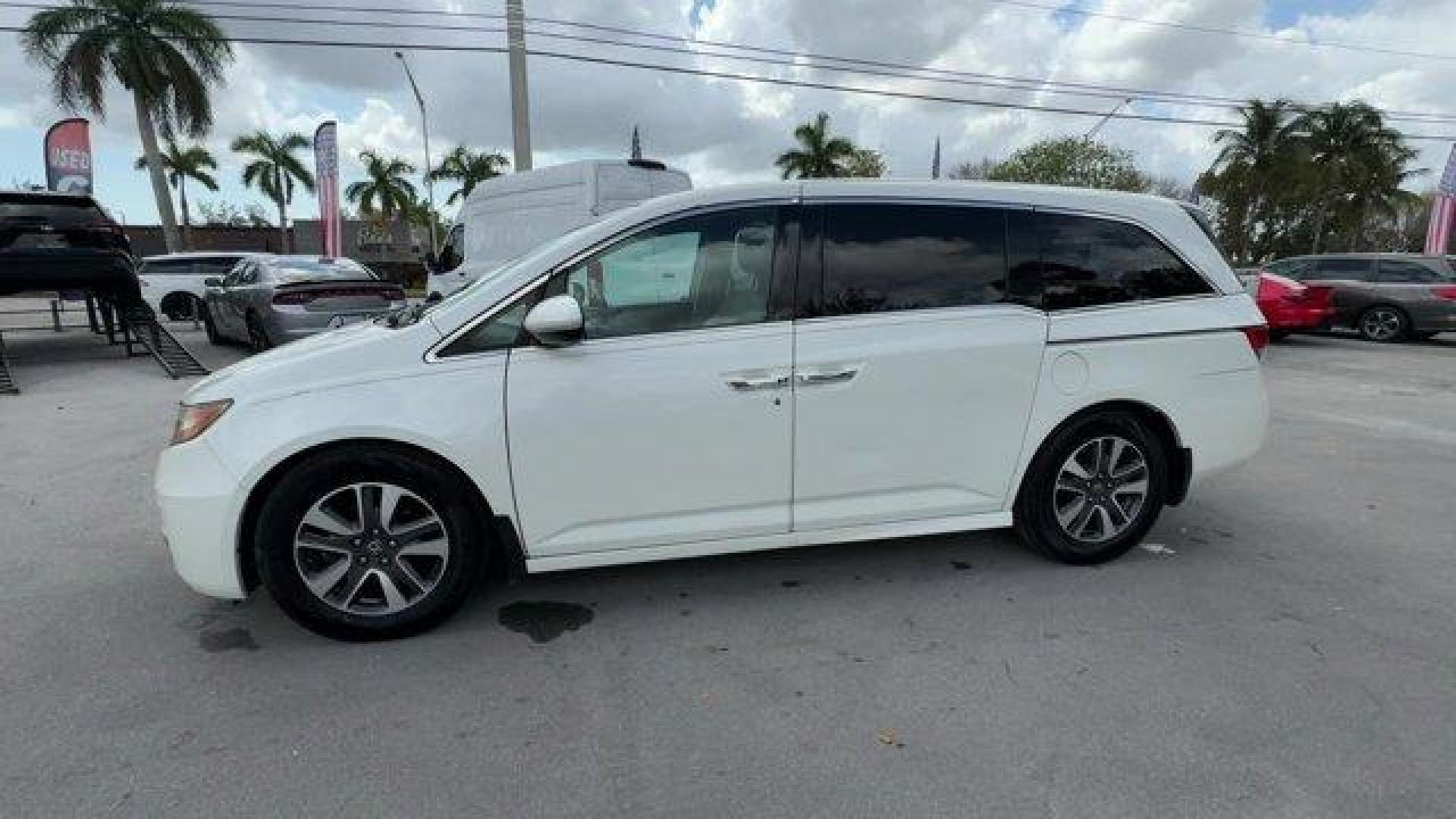 2016 White Honda Odyssey (5FNRL5H92GB) with an 6 3.5 L engine, Automatic transmission, located at 27610 S Dixie Hwy, Homestead, FL, 33032, (305) 749-2348, 25.510241, -80.438301 - KBB.com Best Buy Awards. Delivers 28 Highway MPG and 19 City MPG! This Honda Odyssey boasts a Regular Unleaded V-6 3.5 L/212 engine powering this Automatic transmission. Window Grid Antenna, Wheels: 18 x 7 Alloy, VSA Electronic Stability Control (ESC).*This Honda Odyssey Comes Equipped with These Op - Photo#1