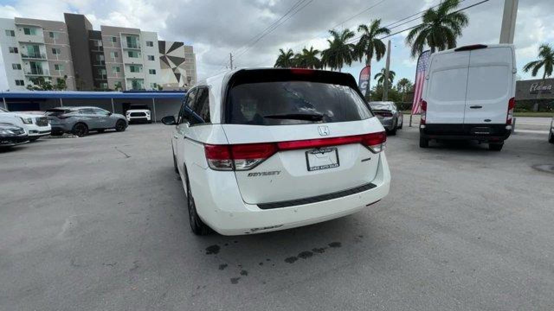 2016 White Honda Odyssey (5FNRL5H92GB) with an 6 3.5 L engine, Automatic transmission, located at 27610 S Dixie Hwy, Homestead, FL, 33032, (305) 749-2348, 25.510241, -80.438301 - KBB.com Best Buy Awards. Delivers 28 Highway MPG and 19 City MPG! This Honda Odyssey boasts a Regular Unleaded V-6 3.5 L/212 engine powering this Automatic transmission. Window Grid Antenna, Wheels: 18 x 7 Alloy, VSA Electronic Stability Control (ESC).*This Honda Odyssey Comes Equipped with These Op - Photo#3