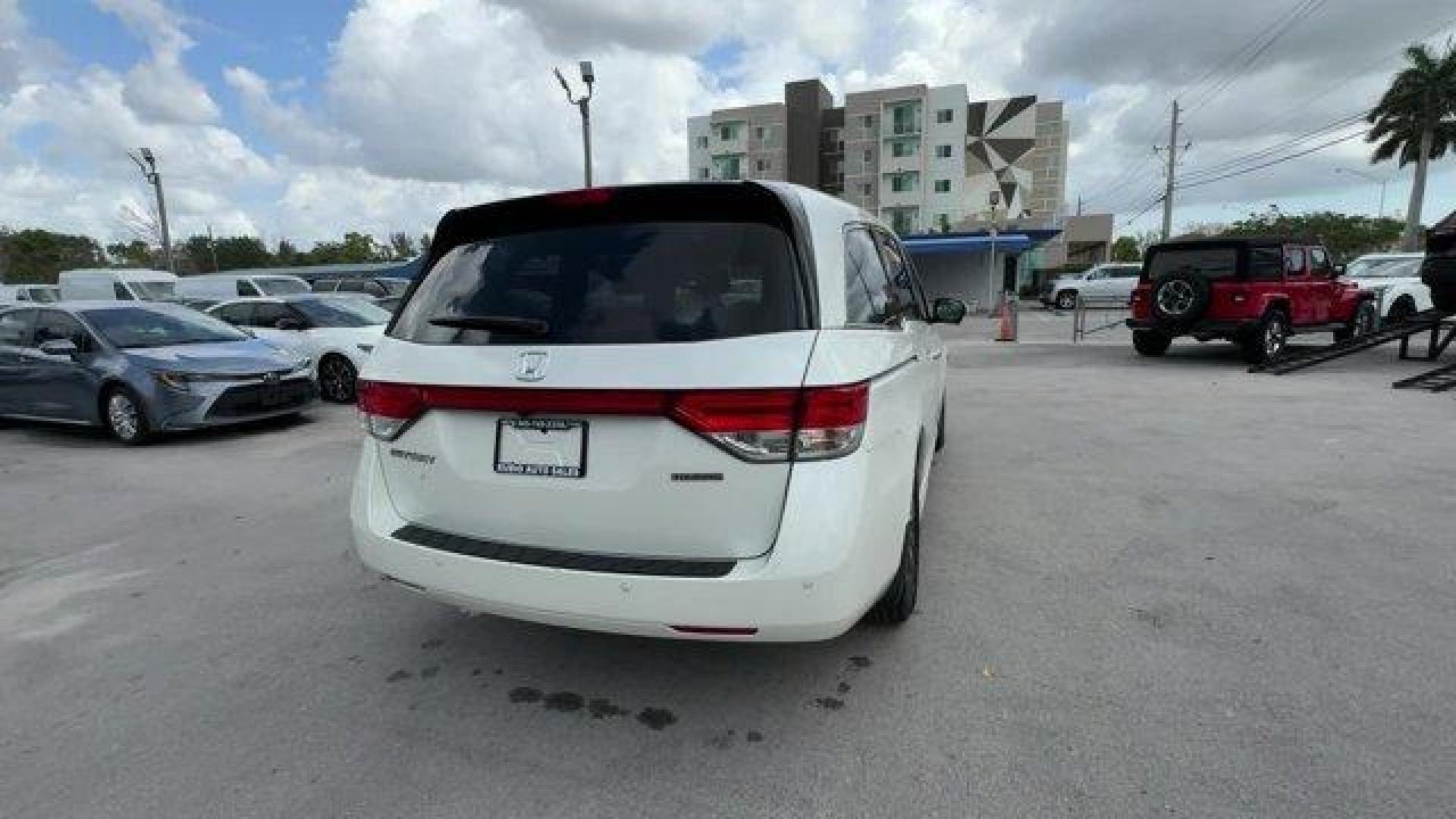 2016 White Honda Odyssey (5FNRL5H92GB) with an 6 3.5 L engine, Automatic transmission, located at 27610 S Dixie Hwy, Homestead, FL, 33032, (305) 749-2348, 25.510241, -80.438301 - KBB.com Best Buy Awards. Delivers 28 Highway MPG and 19 City MPG! This Honda Odyssey boasts a Regular Unleaded V-6 3.5 L/212 engine powering this Automatic transmission. Window Grid Antenna, Wheels: 18 x 7 Alloy, VSA Electronic Stability Control (ESC).*This Honda Odyssey Comes Equipped with These Op - Photo#4