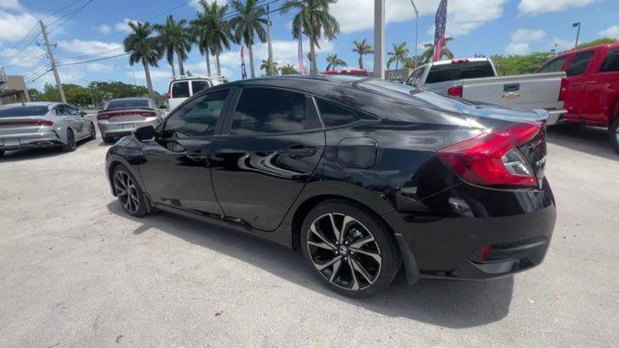 2021 Black Honda Civic Sedan (2HGFC2F85MH) with an 4 2.0 L engine, Variable transmission, located at 27610 S Dixie Hwy, Homestead, FL, 33032, (305) 749-2348, 25.510241, -80.438301 - Boasts 37 Highway MPG and 29 City MPG! This Honda Civic Sedan boasts a Regular Unleaded I-4 2.0 L/122 engine powering this Variable transmission. Window Grid Antenna, Wheels: 18 Alloy w/Gloss Black Inserts, Vehicle Stability Assist (VSA) Electronic Stability Control (ESC).* This Honda Civic Sedan Fe - Photo #2