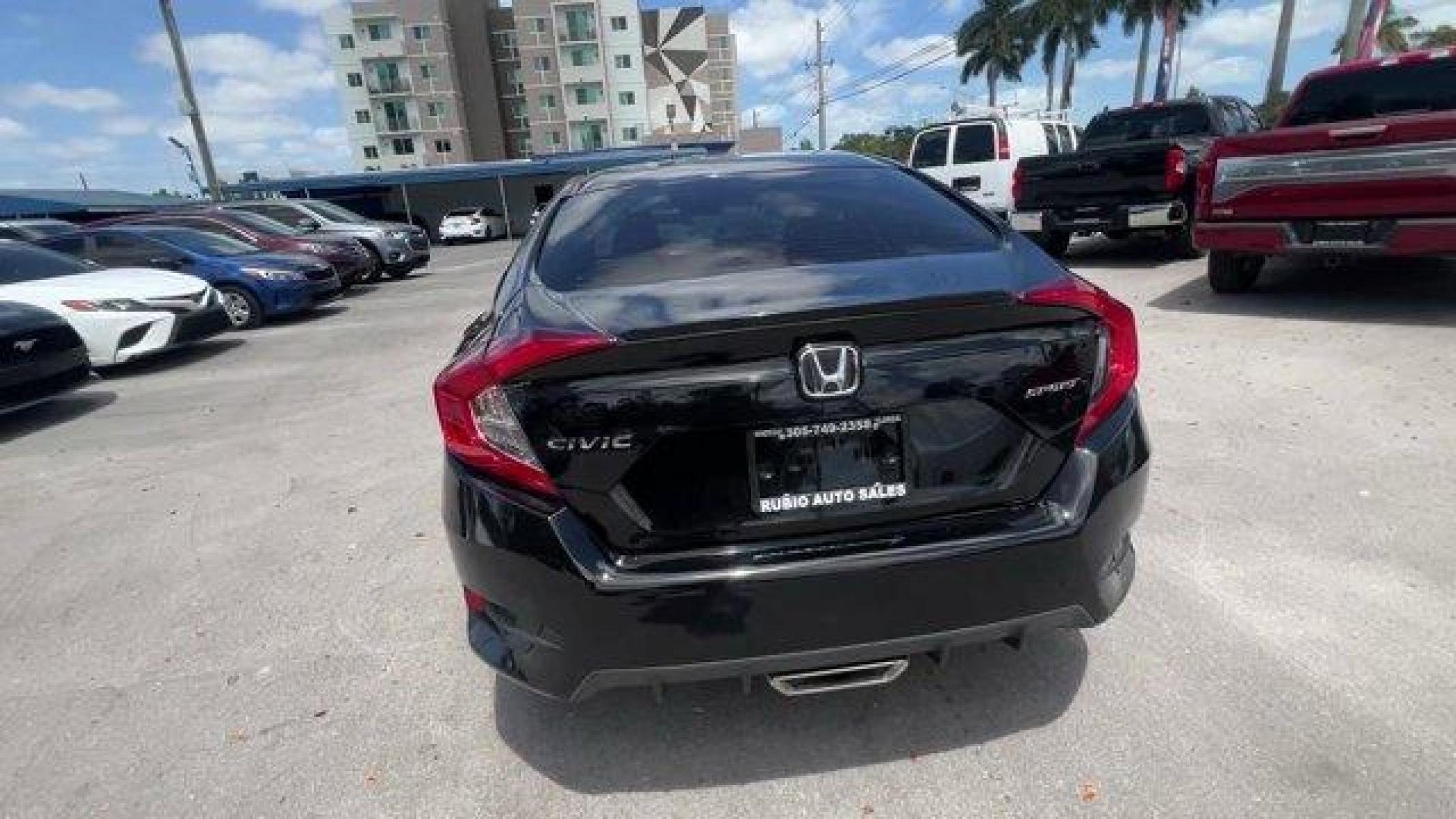 2021 Black Honda Civic Sedan (2HGFC2F85MH) with an 4 2.0 L engine, Variable transmission, located at 27610 S Dixie Hwy, Homestead, FL, 33032, (305) 749-2348, 25.510241, -80.438301 - Boasts 37 Highway MPG and 29 City MPG! This Honda Civic Sedan boasts a Regular Unleaded I-4 2.0 L/122 engine powering this Variable transmission. Window Grid Antenna, Wheels: 18 Alloy w/Gloss Black Inserts, Vehicle Stability Assist (VSA) Electronic Stability Control (ESC).* This Honda Civic Sedan Fe - Photo #3
