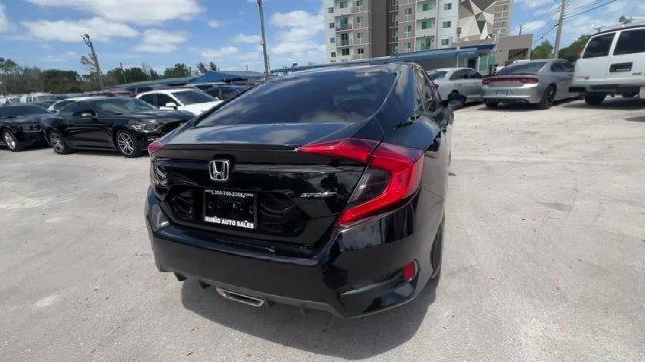2021 Black Honda Civic Sedan (2HGFC2F85MH) with an 4 2.0 L engine, Variable transmission, located at 27610 S Dixie Hwy, Homestead, FL, 33032, (305) 749-2348, 25.510241, -80.438301 - Boasts 37 Highway MPG and 29 City MPG! This Honda Civic Sedan boasts a Regular Unleaded I-4 2.0 L/122 engine powering this Variable transmission. Window Grid Antenna, Wheels: 18 Alloy w/Gloss Black Inserts, Vehicle Stability Assist (VSA) Electronic Stability Control (ESC).* This Honda Civic Sedan Fe - Photo #4