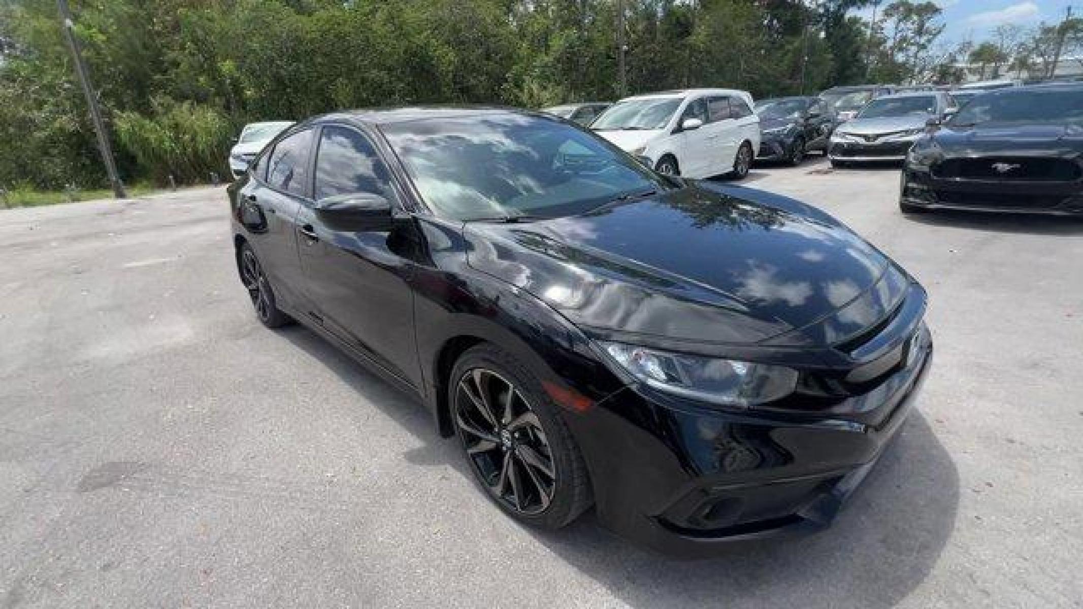 2021 Black Honda Civic Sedan (2HGFC2F85MH) with an 4 2.0 L engine, Variable transmission, located at 27610 S Dixie Hwy, Homestead, FL, 33032, (305) 749-2348, 25.510241, -80.438301 - Boasts 37 Highway MPG and 29 City MPG! This Honda Civic Sedan boasts a Regular Unleaded I-4 2.0 L/122 engine powering this Variable transmission. Window Grid Antenna, Wheels: 18 Alloy w/Gloss Black Inserts, Vehicle Stability Assist (VSA) Electronic Stability Control (ESC).* This Honda Civic Sedan Fe - Photo #6