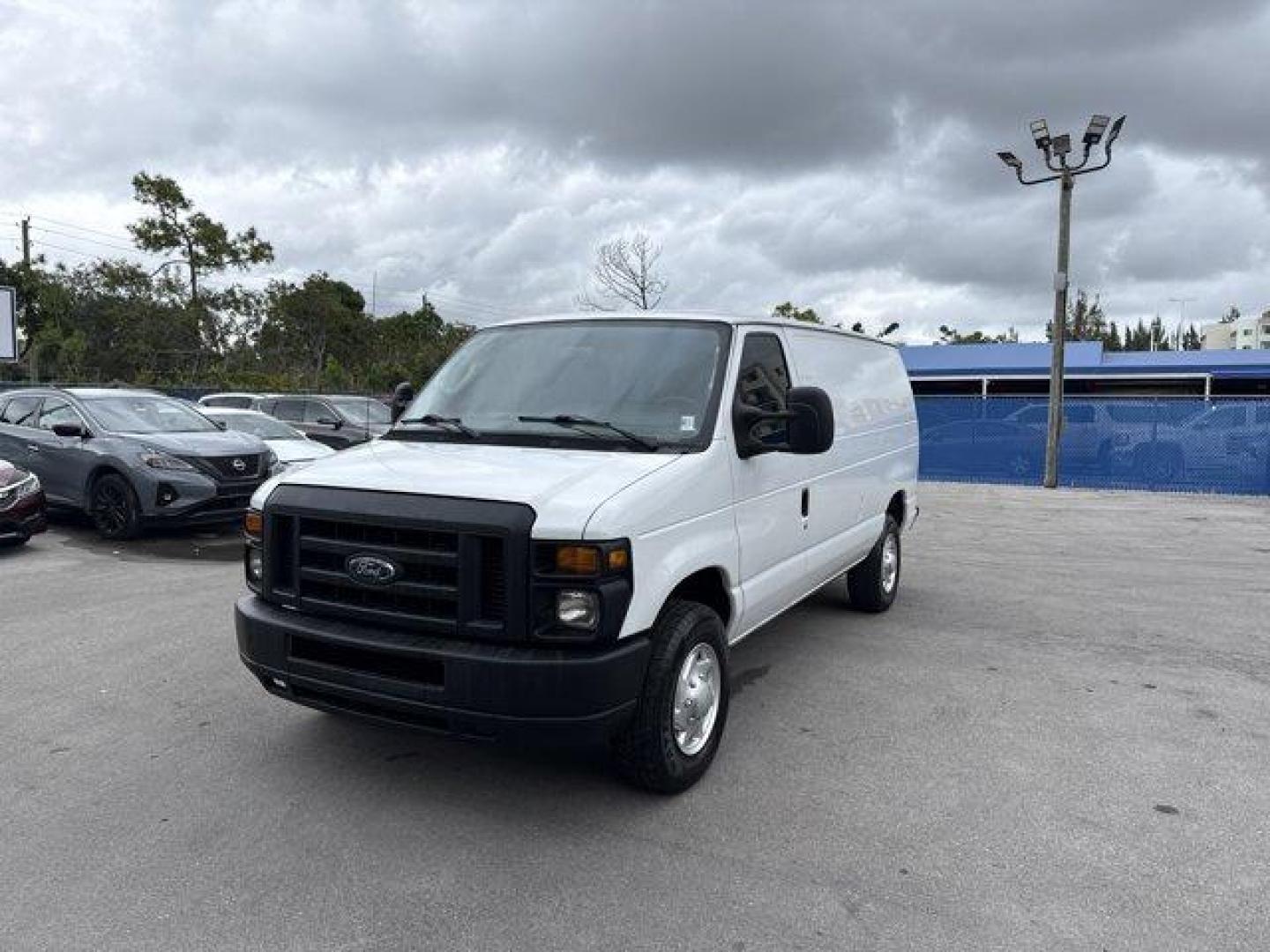 2014 White Ford Econoline Cargo Van (1FTNE2EW9ED) with an 8 4.6 L engine, Automatic transmission, located at 27610 S Dixie Hwy, Homestead, FL, 33032, (305) 749-2348, 25.510241, -80.438301 - KBB.com Brand Image Awards. Only 129,906 Miles! Delivers 16 Highway MPG and 13 City MPG! This Ford Econoline Cargo Van delivers a Regular Unleaded V-8 4.6 L/281 engine powering this Automatic transmission. Wheels: 16 x 7 Steel, Variable Intermittent Wipers, Urethane Gear Shifter Material.*This Ford - Photo#0